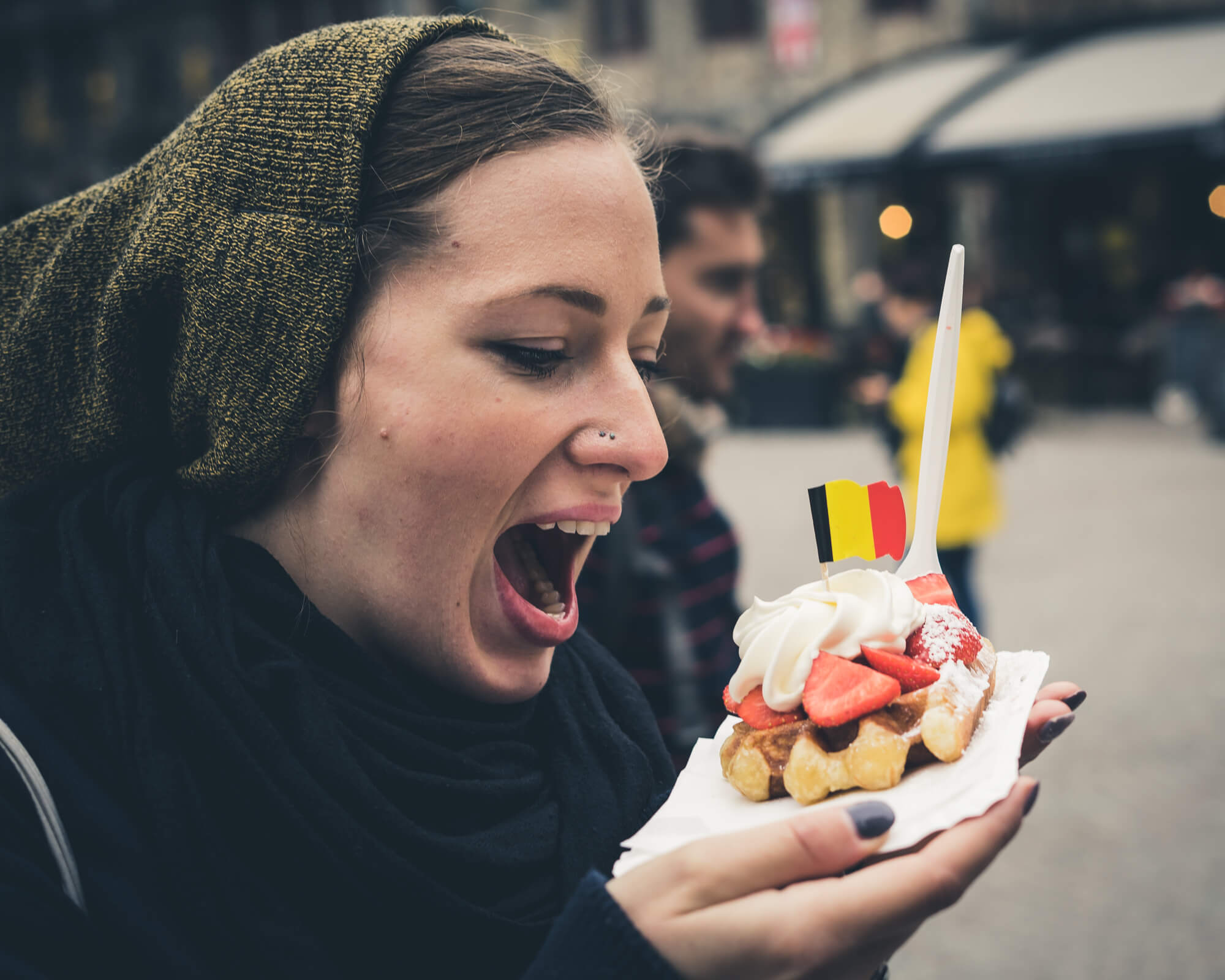 Loren scarfing waffles in Belgium