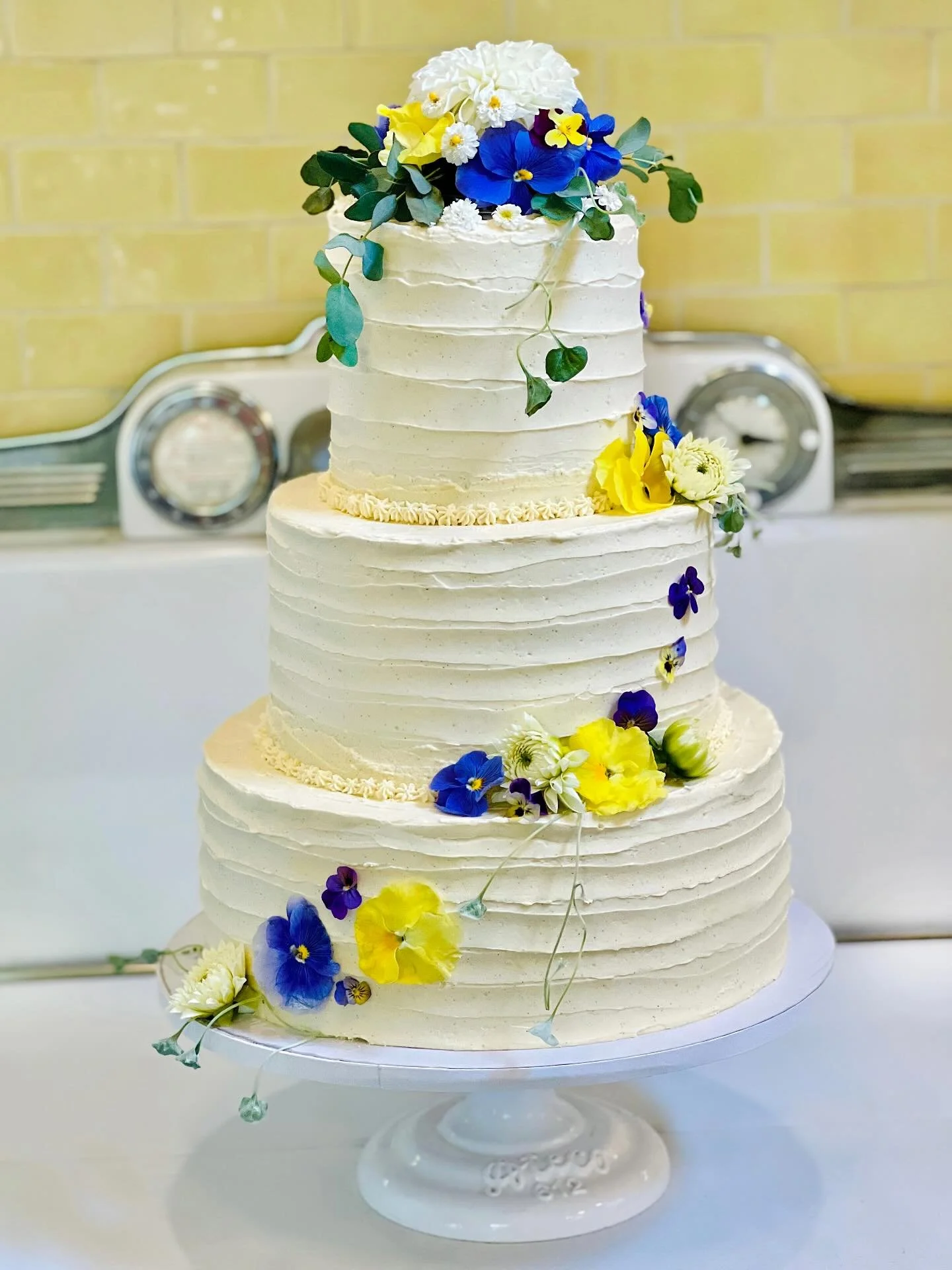 Its&rsquo;s done! This weekend&rsquo;s Wedding Cake for Brandi &amp; Sam. The flavors are simple: vanilla bean &amp; Fiori de Sicilia in the cake and the frosting. You can&rsquo;t see them but there are so many @harrysberries in there in the fresh be