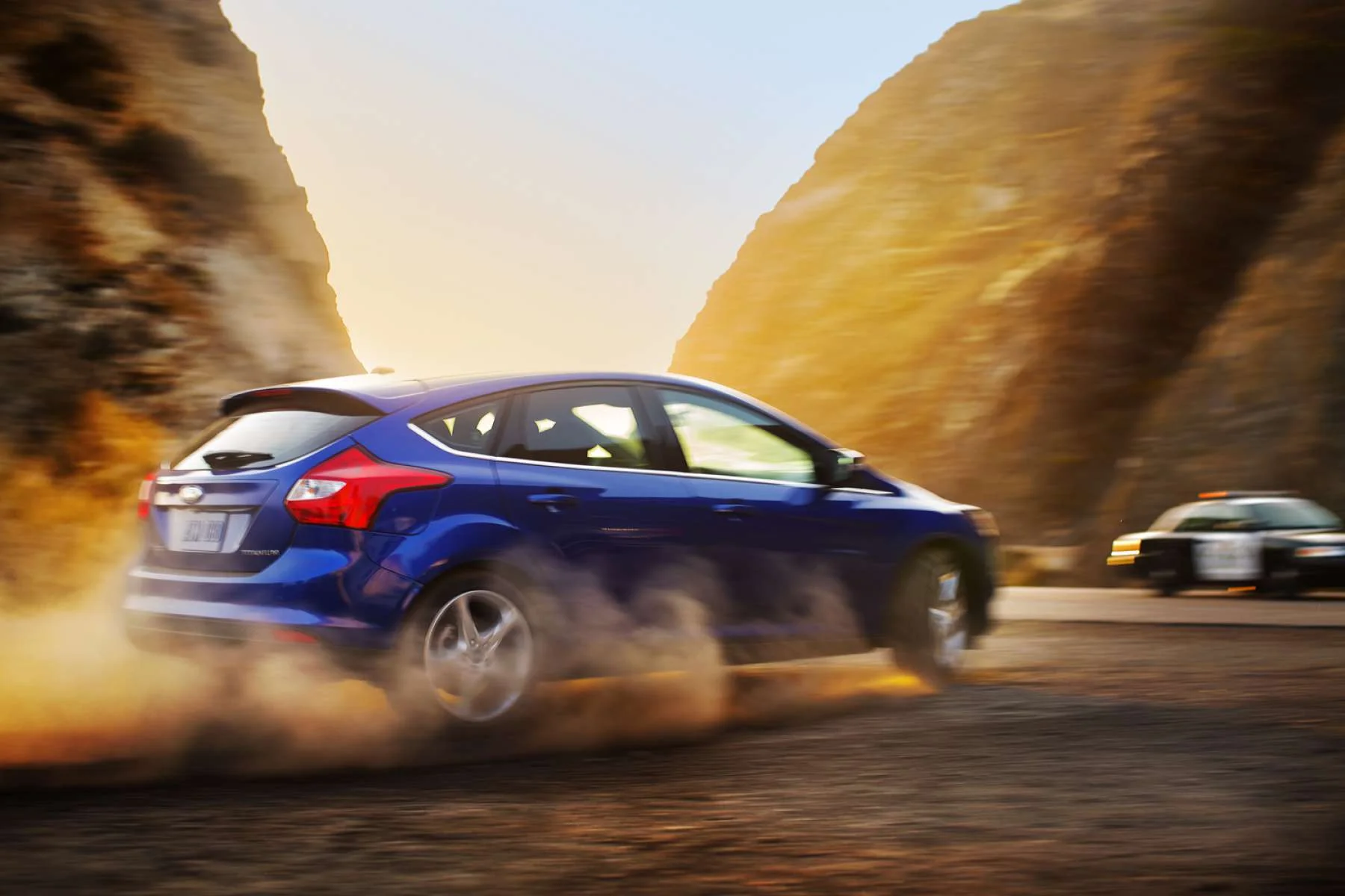 520bd9da4b00e_Christian_Kozowyk_car_burnout_dirt_road.jpg