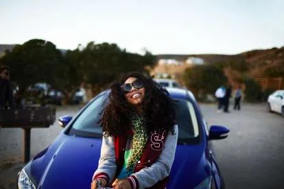 520d2c40bba3b_Christian_Kozowyk_girl_leaning_on_car.jpg