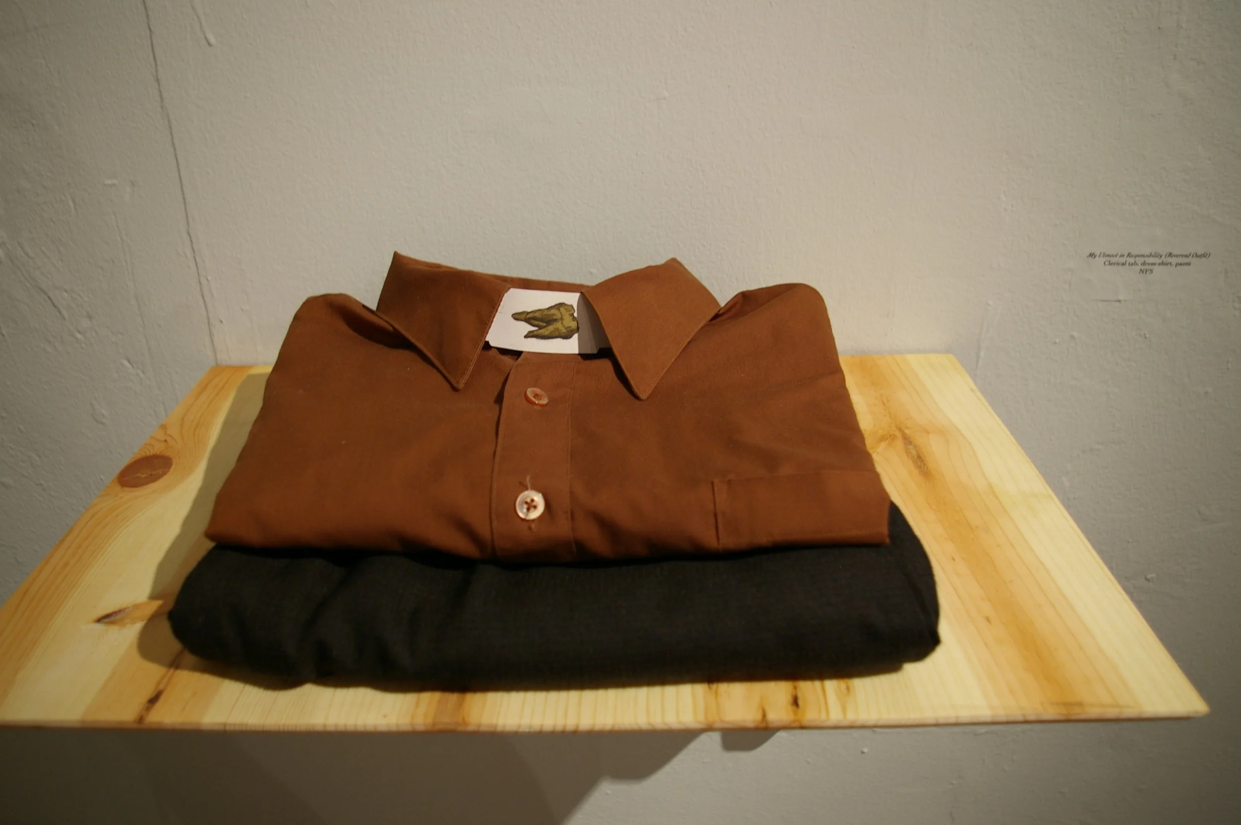  this is an installation shot of the clerical collar, dress shirt, and pants. to me the tooth represents wisdom and i though it appropriate for the clerical collar icon.&nbsp; 