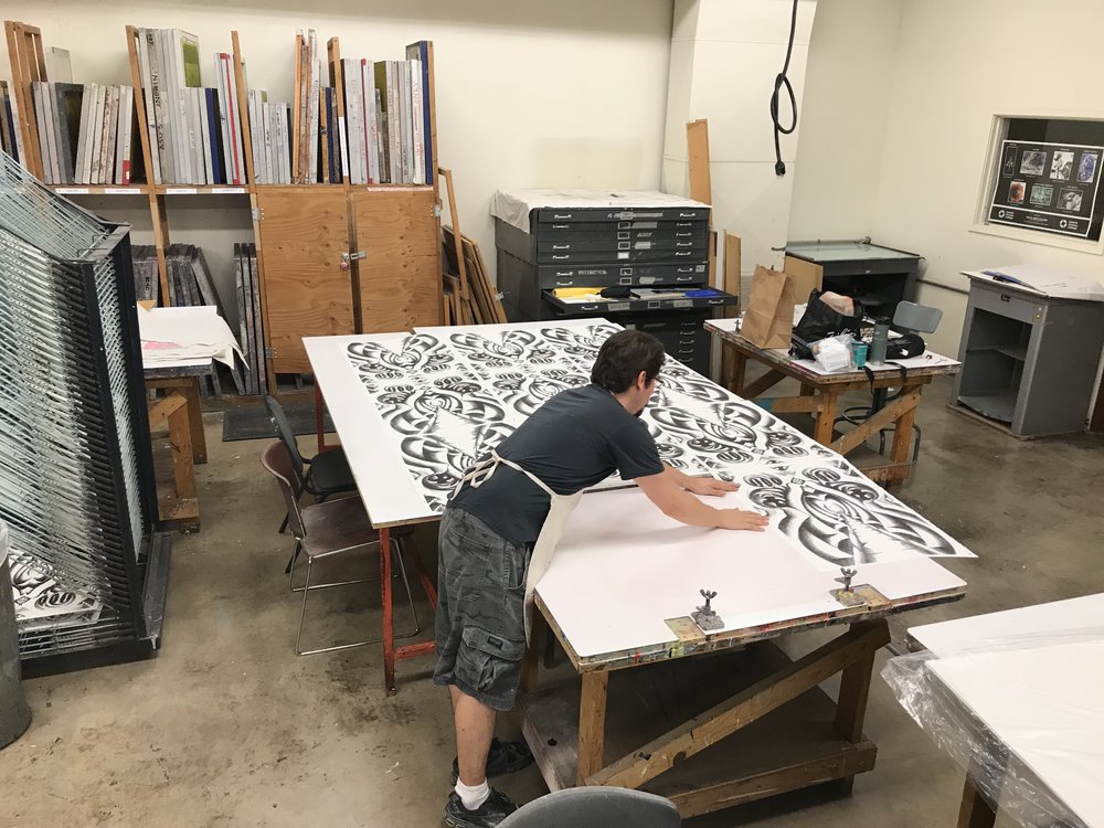  Carlos is laying out the finished prints into a tiled grid.&nbsp; 