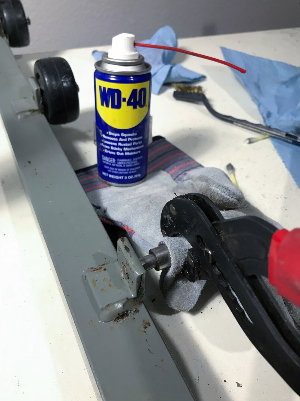  the enforcement crew: wd-40, pliers, and leather gloves. 