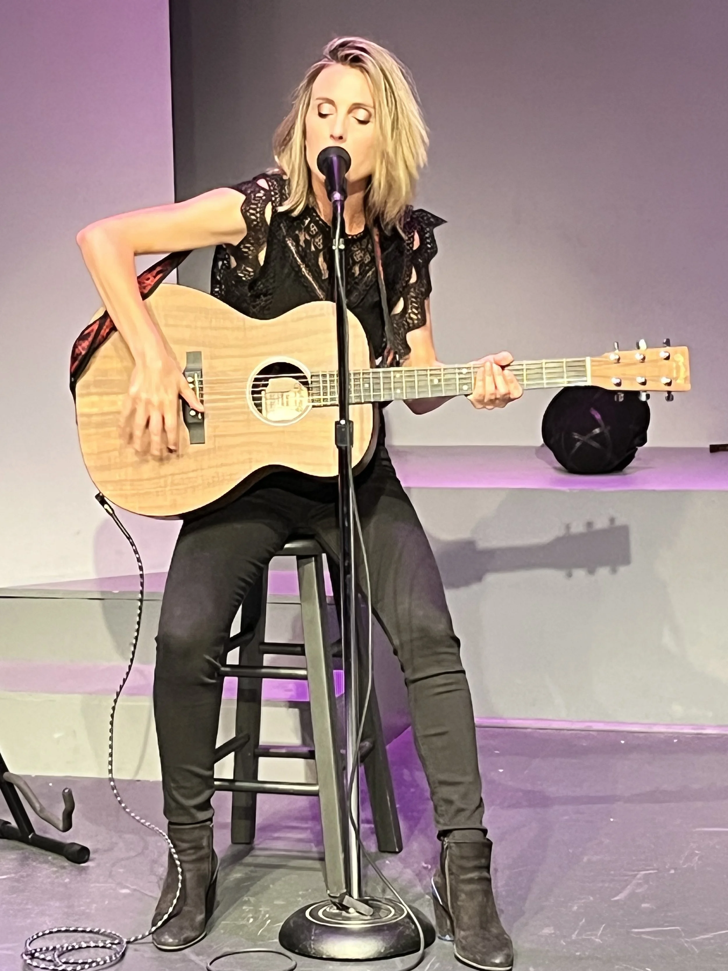 Kacie Concert Photo Arm Up Guitar .JPEG