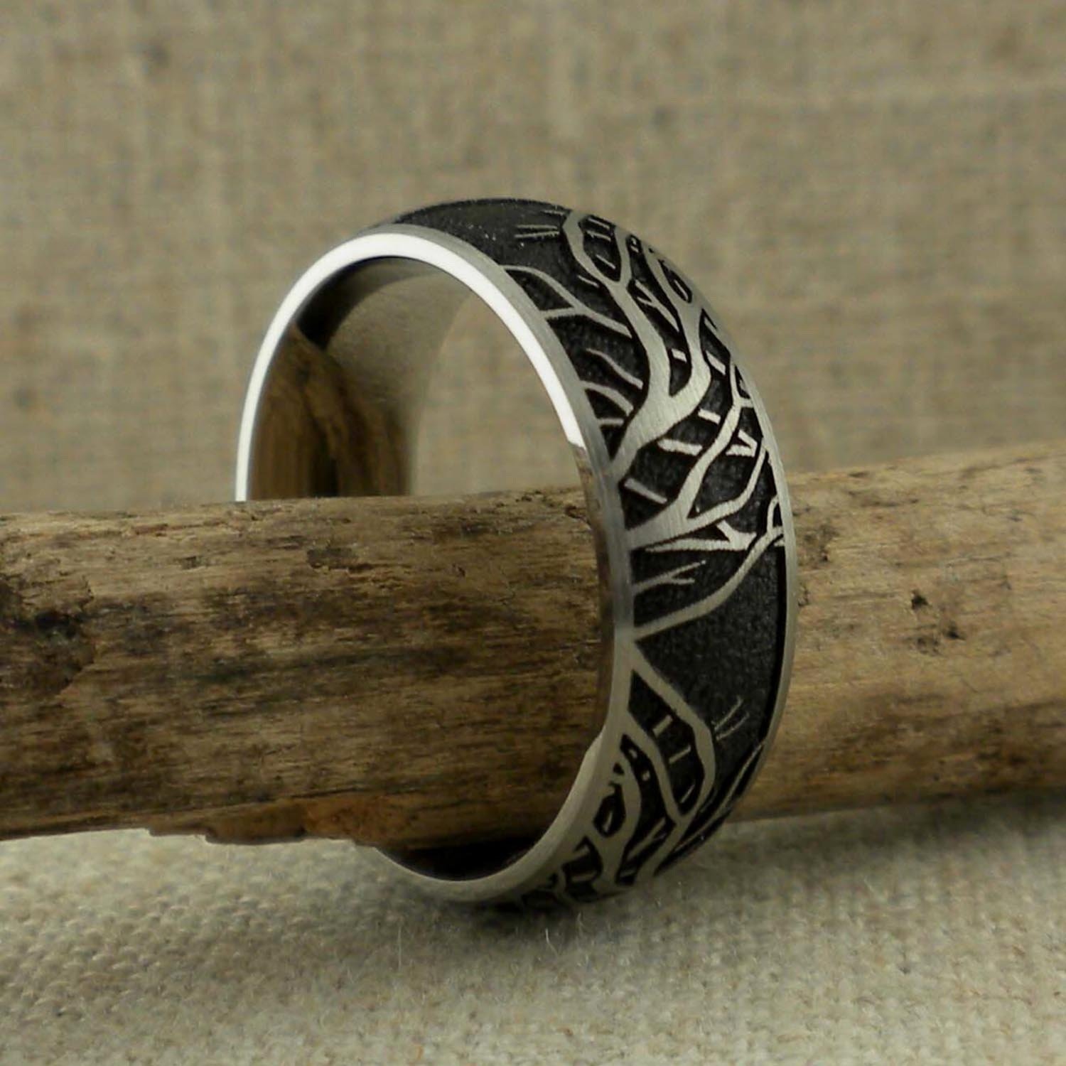 Domed Titanium Wedding Ring with Tree of Life Branches Black Background ...