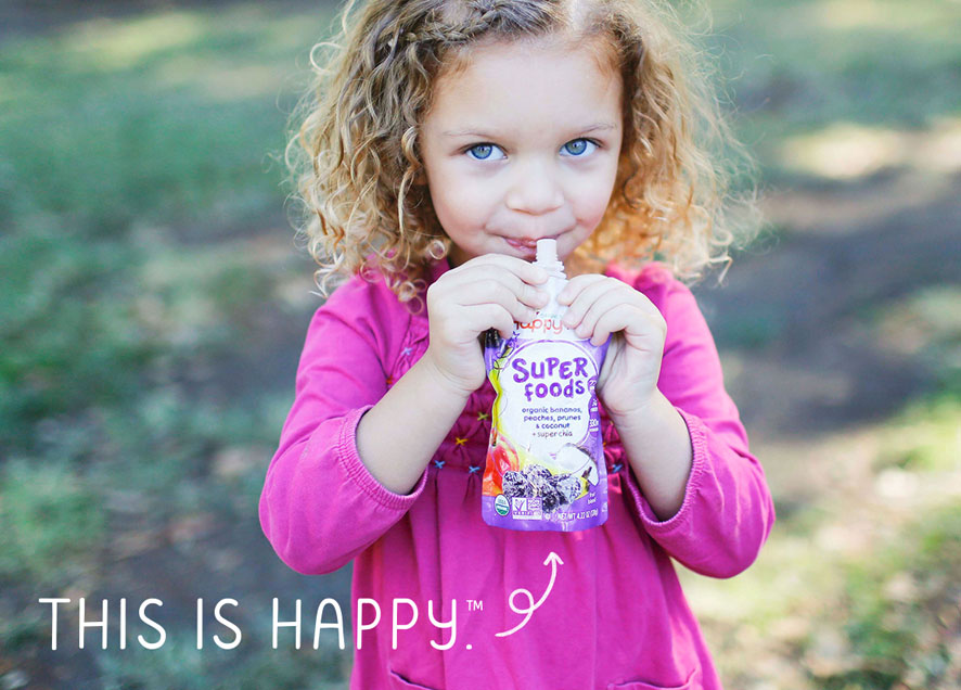 le-happyfamily-child-sipping-pouch.jpg