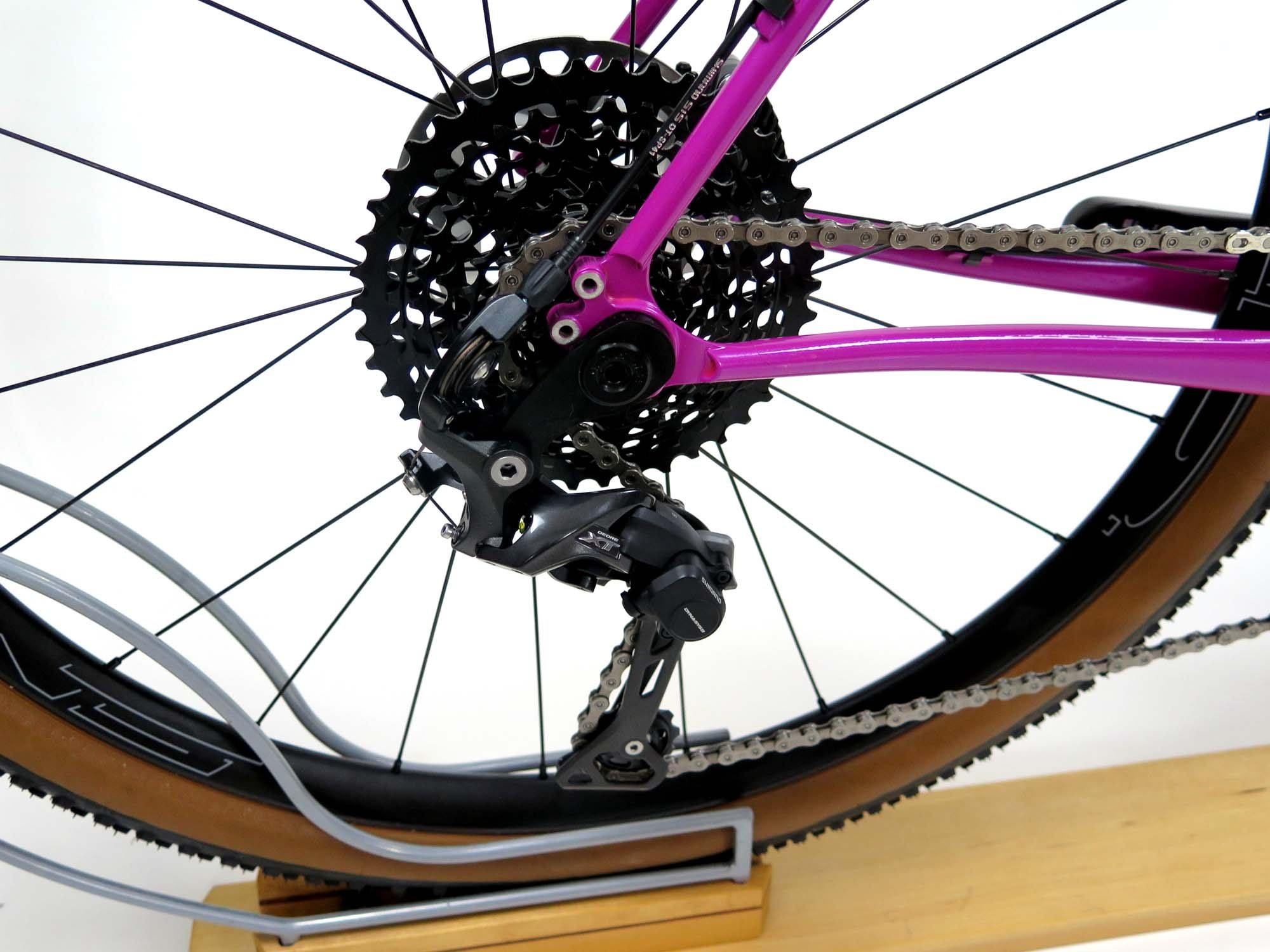  Out back, this SRAM 10x42 cassette ensures there’s no hill too steep!  We used a Wolf Tooth Tanpan so the XT rear derailleur would work with the Ultegra shifters.    