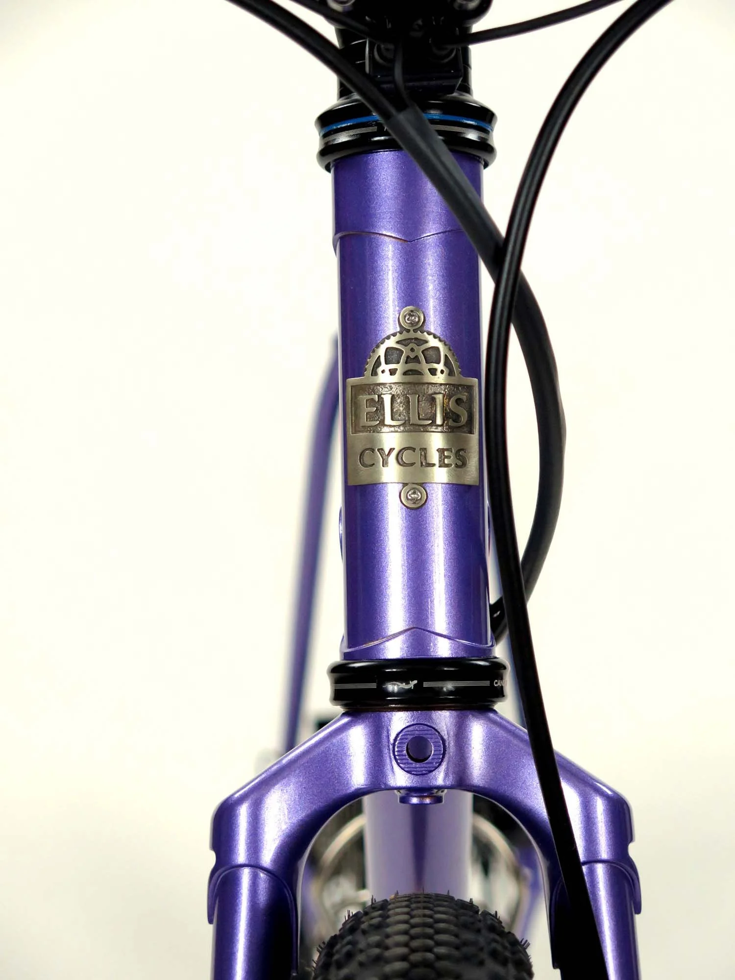  Another shot of the headbadge along with the nice clearance for knobby tires in this custom steel fork.   