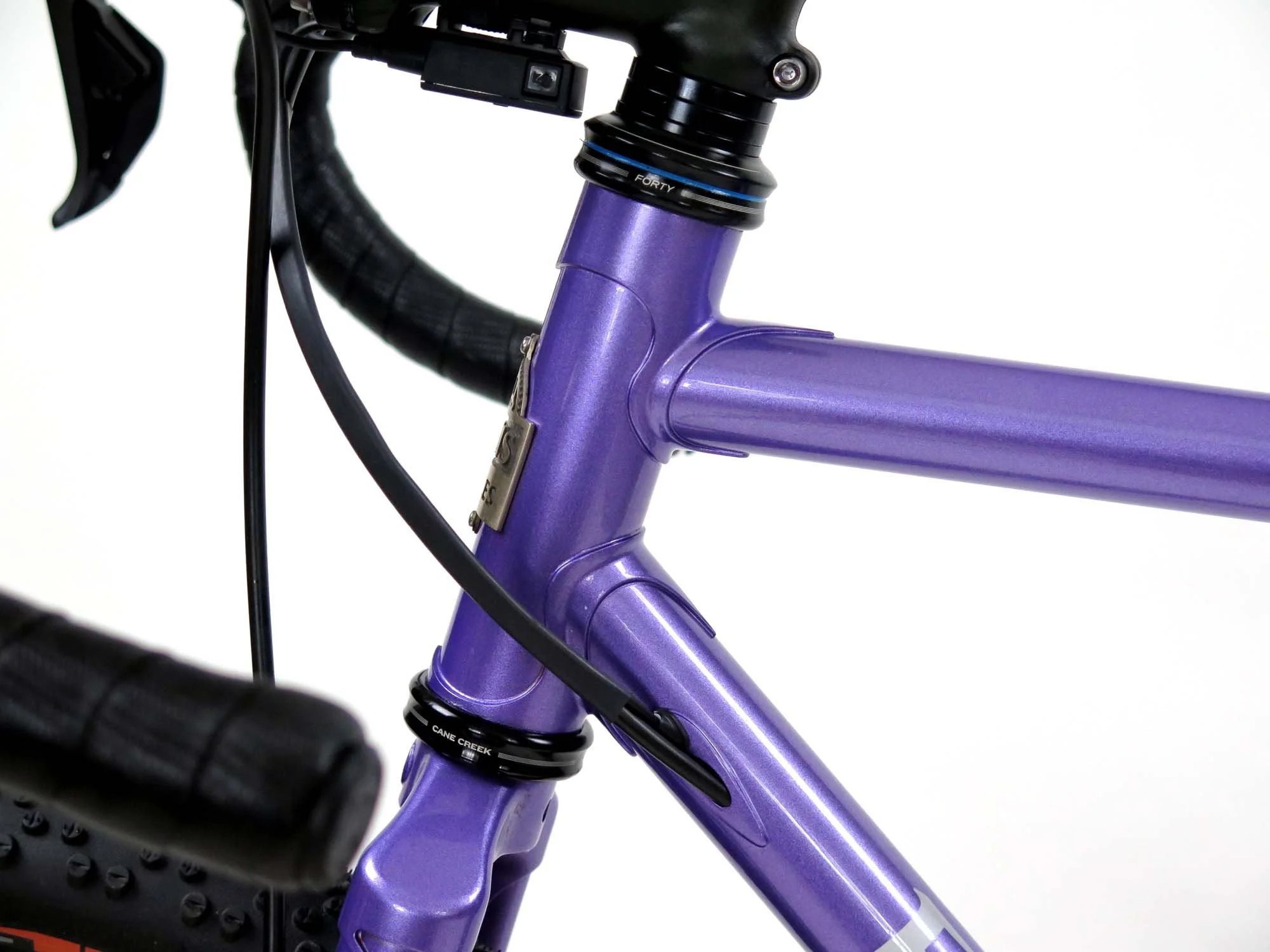  A close up of the internal ports for the rear brake housing and the Di2 wires entering the down tube.   