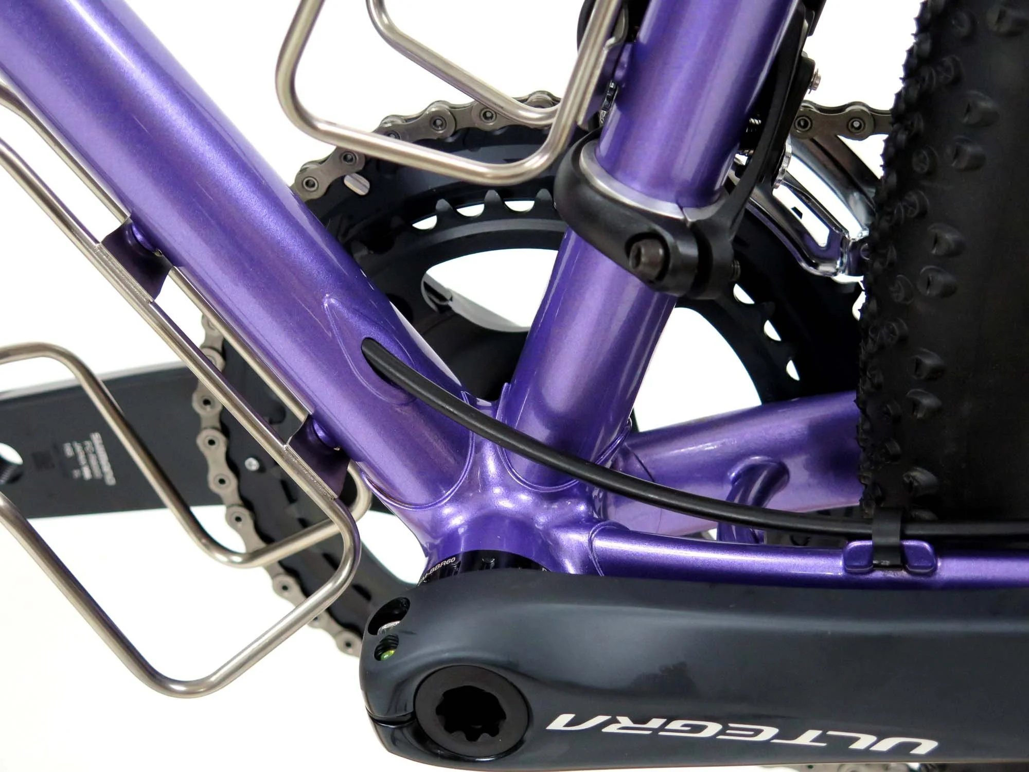  Rear brake line exits the down tube and heads down the chainstay.  If you look closely you can see the offset custom front derailleur shim that I made so that XT Di2 derailleurs would work with my Ultegra cross crank’s chainline.  It’s the key to ma