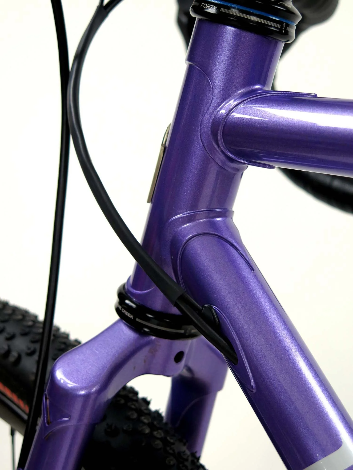 Another nice view of the head lugs, fork crown and internal cable routing.   