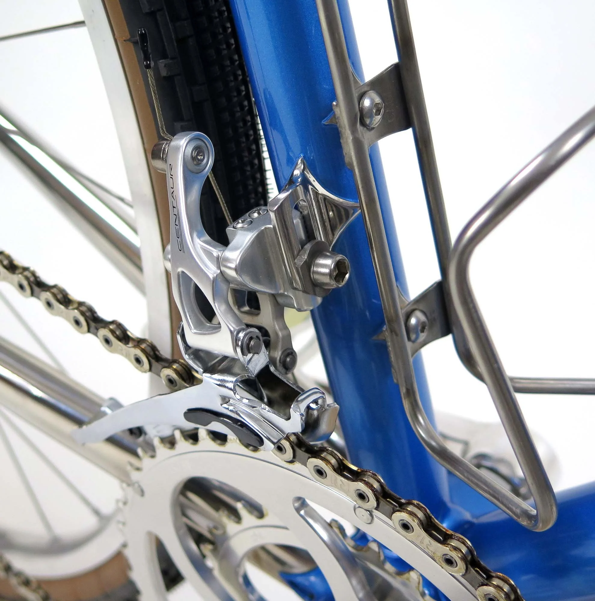  A polished stainless front derailleur hanger with a silver Campy Centaur front derailleur and a Rene Herse crankset.   