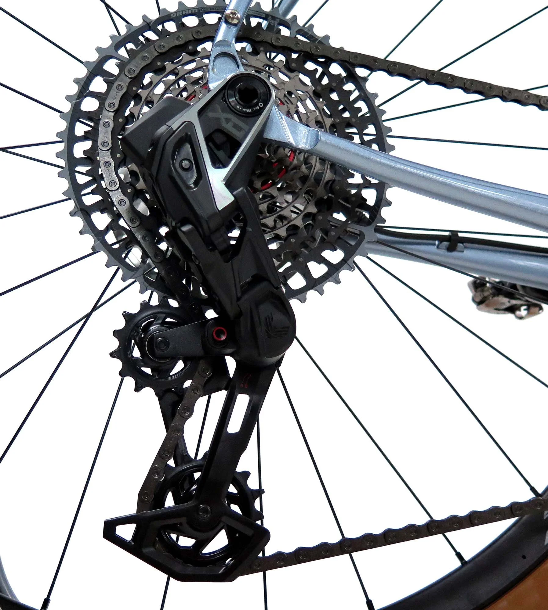  The SRAM XO Transmission rear derailleur looks a bit massive, but it’s performance with blow you away.  It actually shifts better under full load!  And the 10x52 cassette means there’s nary a hill that can’t be climbed.   