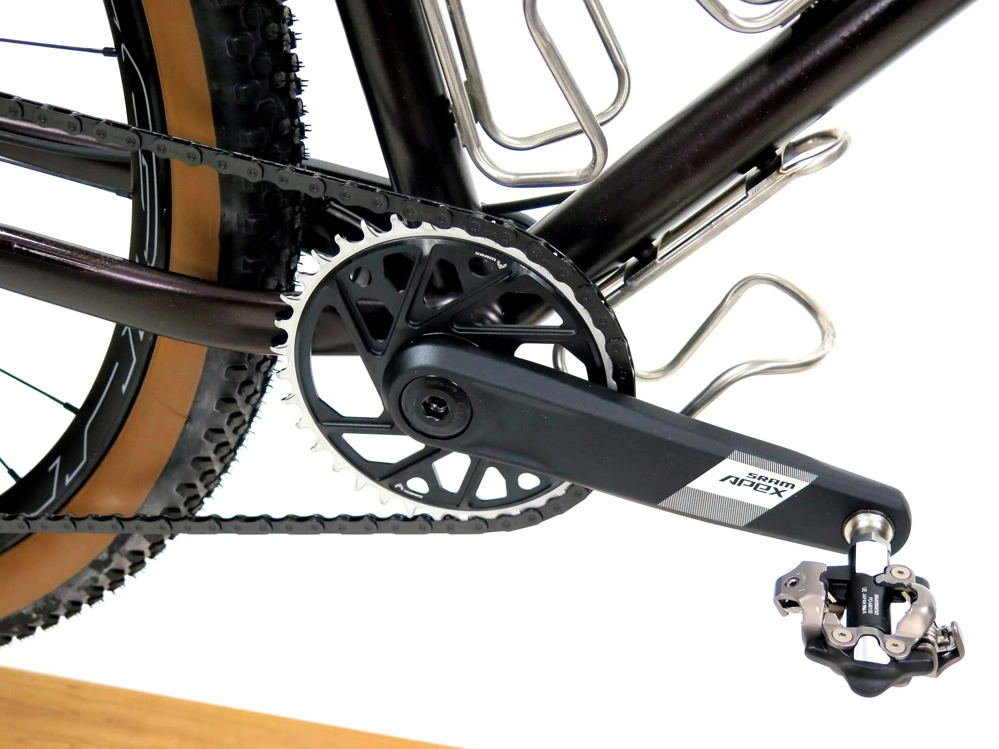  Even with the wide tire clearance I hoped that I could still run a road crankset with a narrower stance, and I managed to squeak this SRAM Apex crank on there with a 36T chainring.   