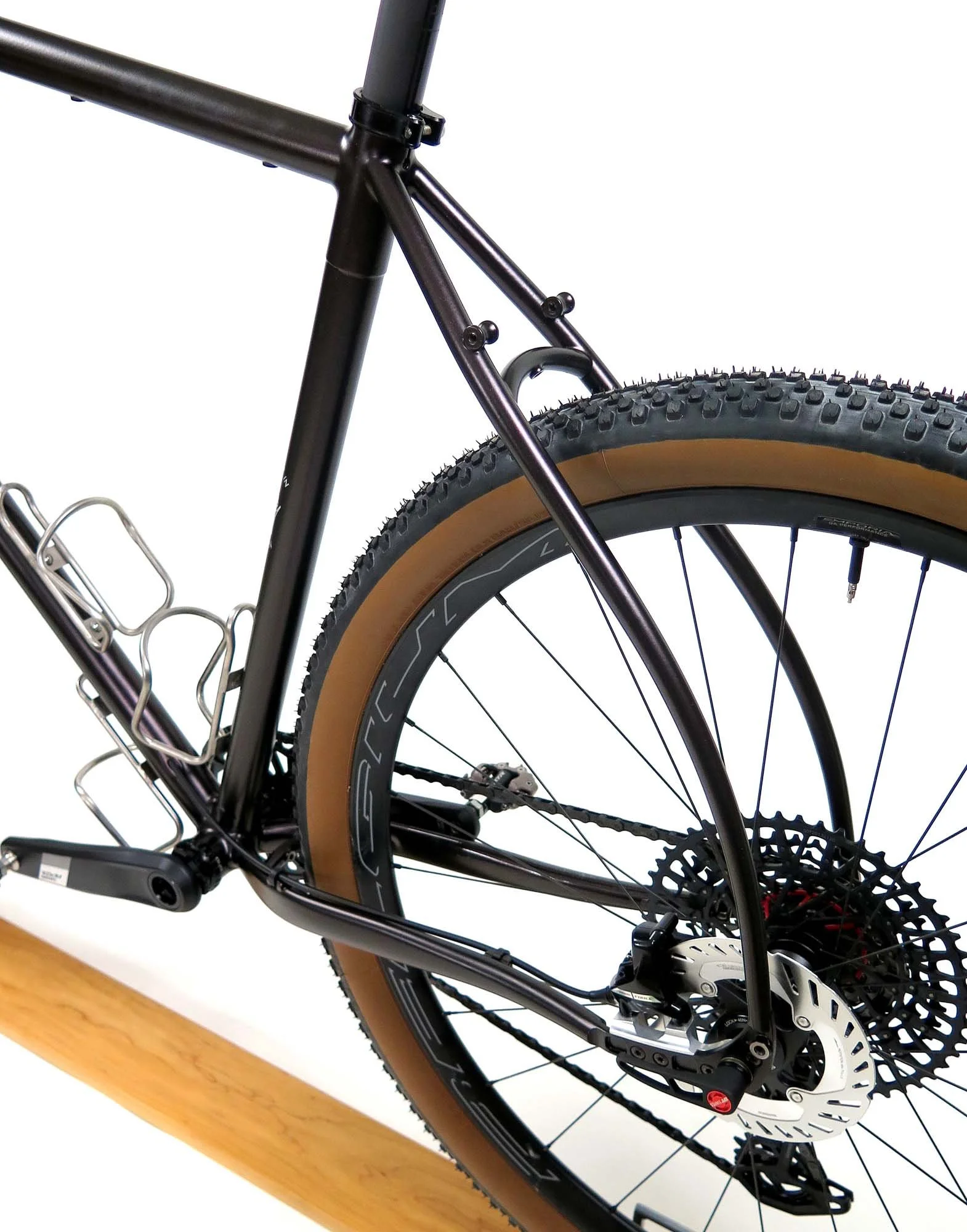  The curved stays look cool, but I mainly bent them in order to have a nicer line where they mate with the Paragon UDH style rear dropouts.  The bosses on the seatstays mean I can load up a rear rack for adventures whenever the trails call.   