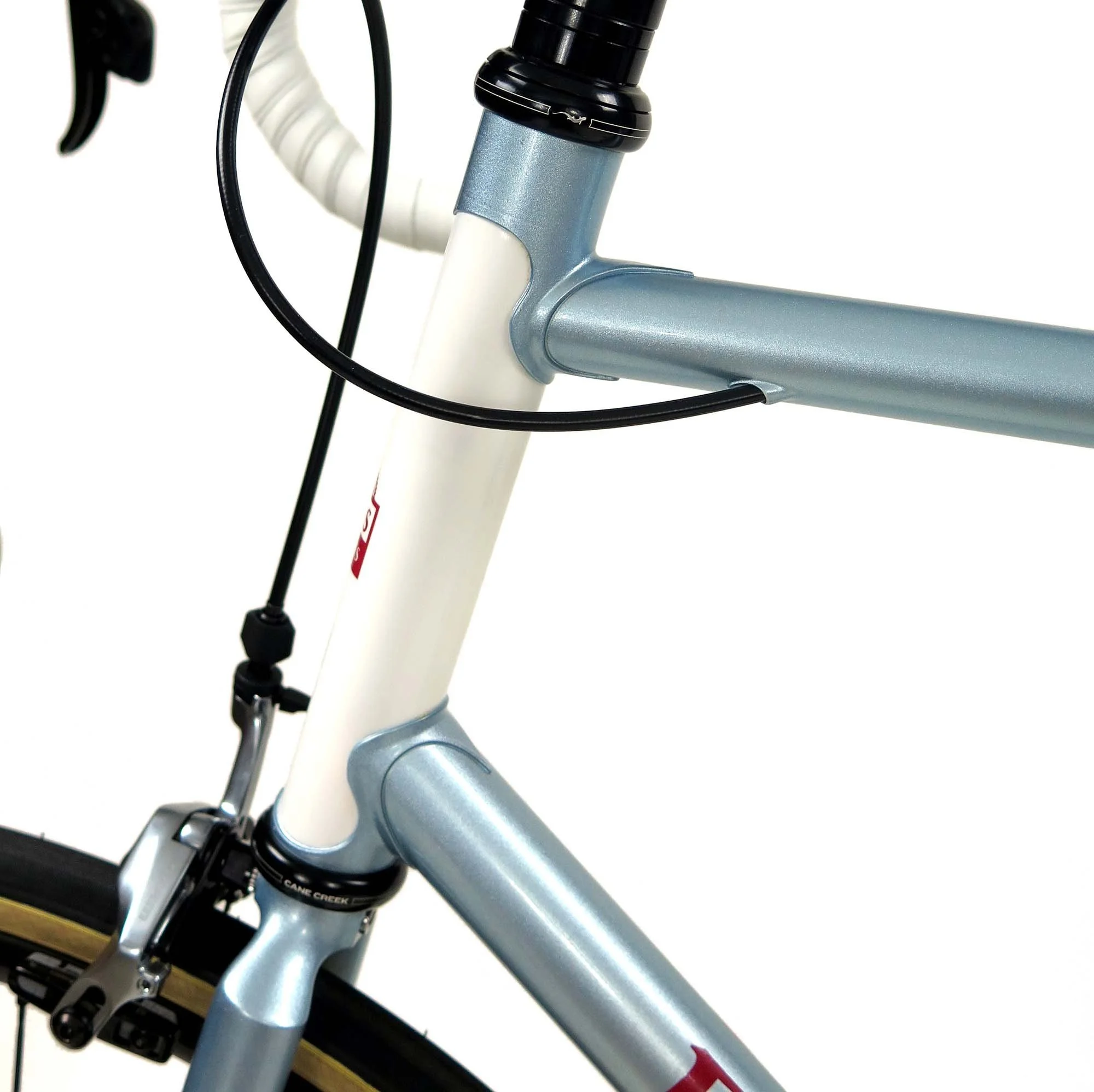  A classic white contrasting head tube and my stainless steel internal routing for the rear brake.   