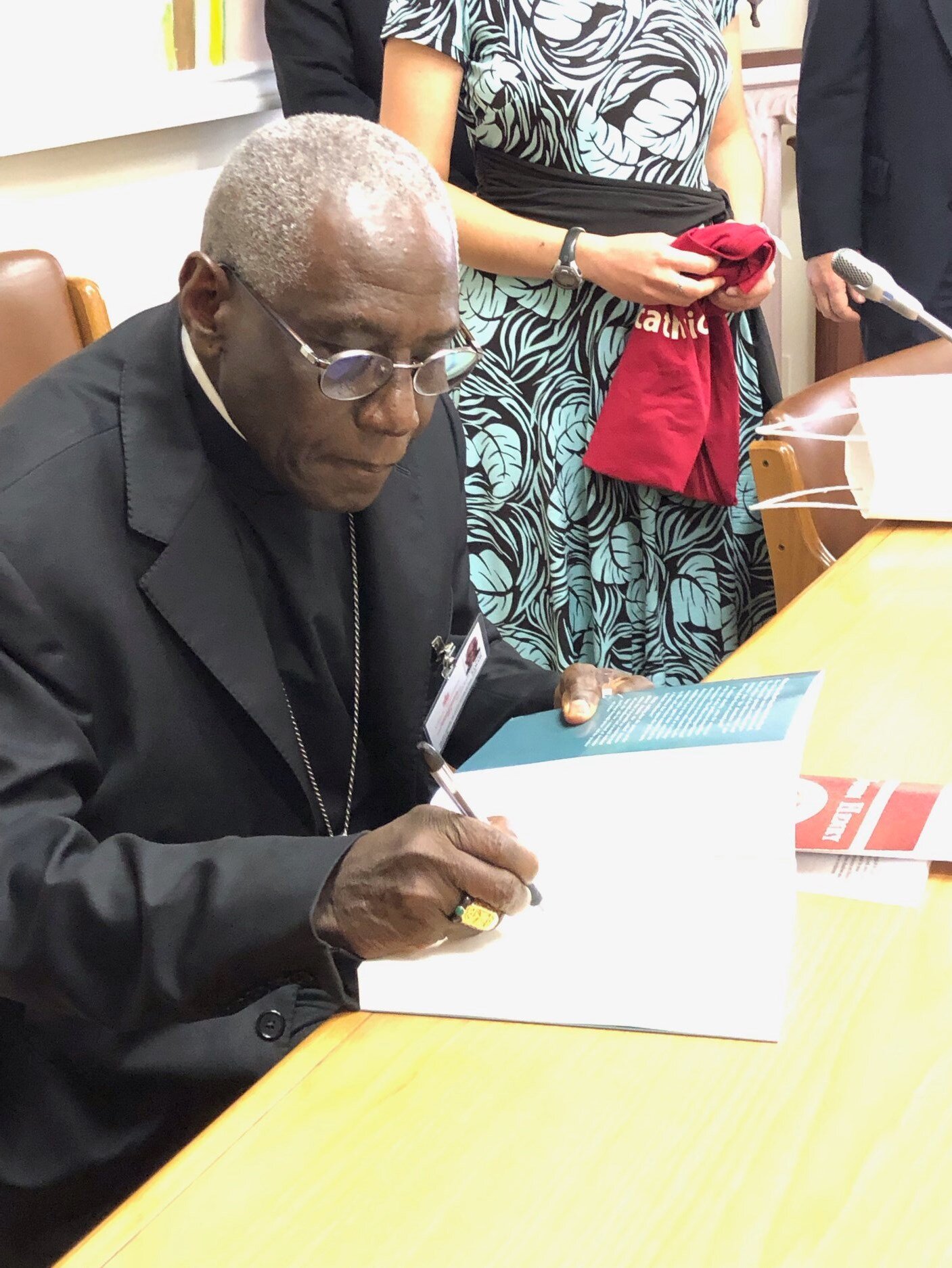Gifting Cardinal Robert Sarah some HuskerCatholic gear