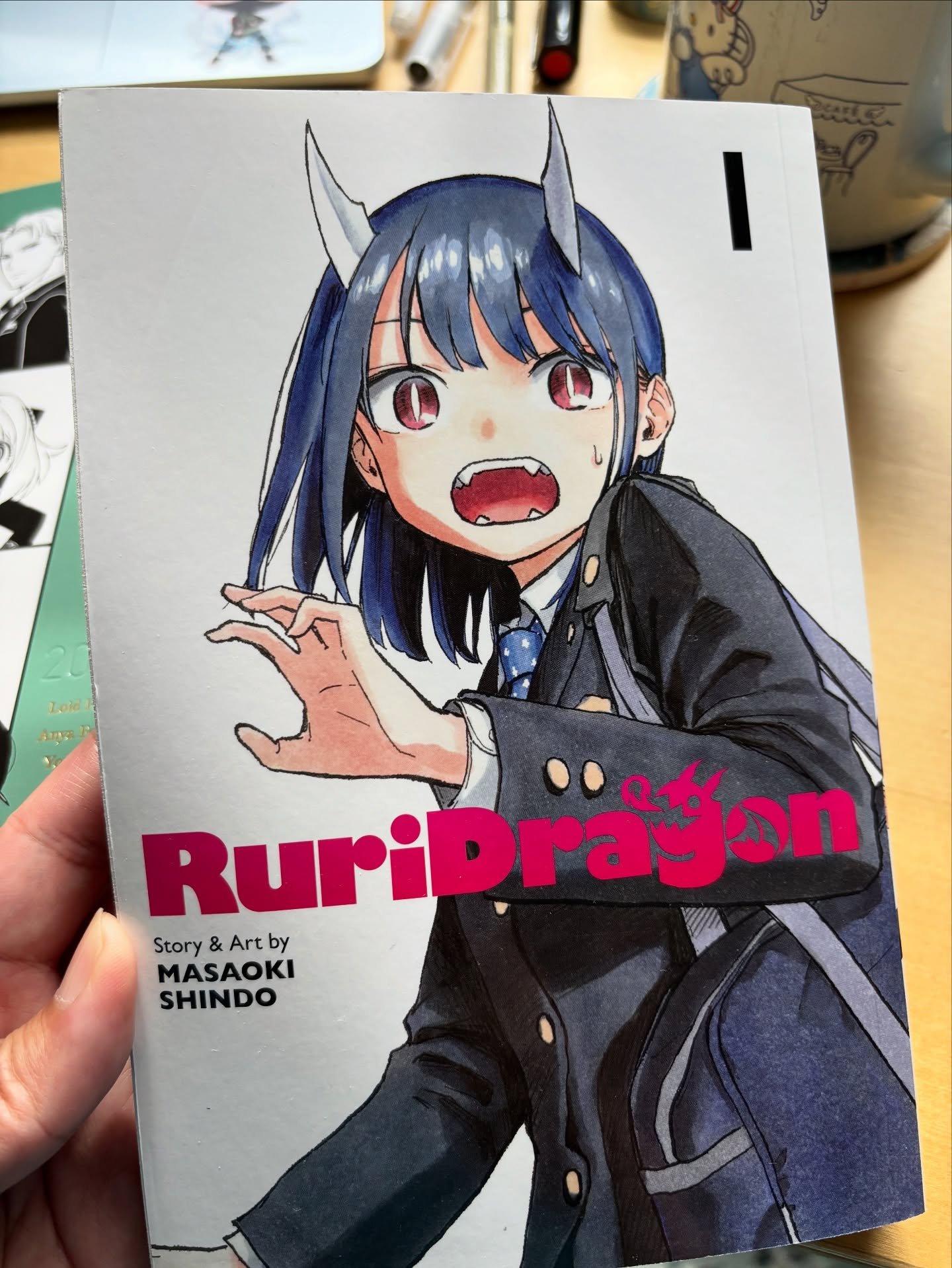 Recent read: RuriDragon by Masaoki Shindo

I picked this up at Awesome Con earlier this year from the Kinokinuya Bookstore booth. Ruri wakes up one day to find horns on her head and learns that her father is actually a dragon. The art is cute and the