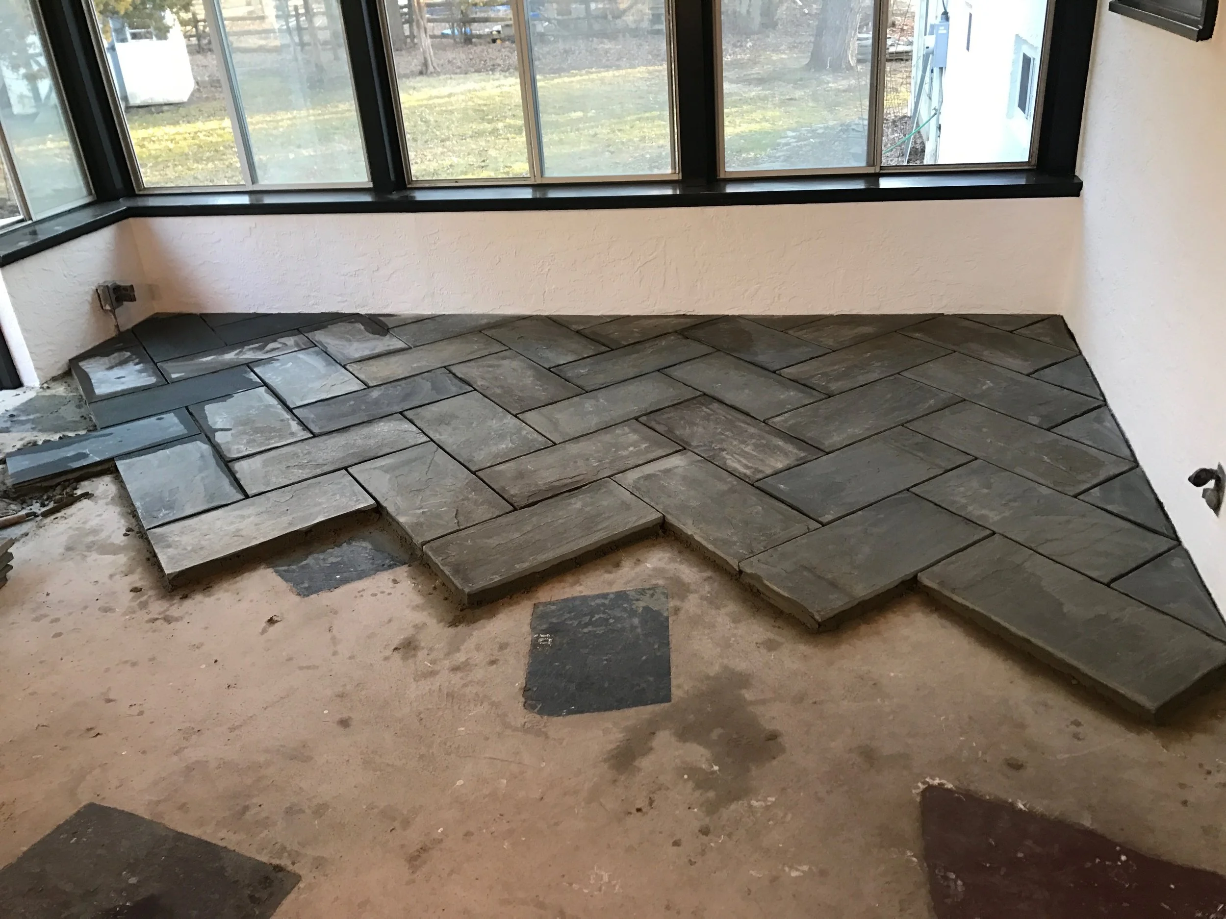 After the ceiling was complete, it was on to the floors. I was dying to have a herringbone somewhere in the house, and we decided this was just the place for it.