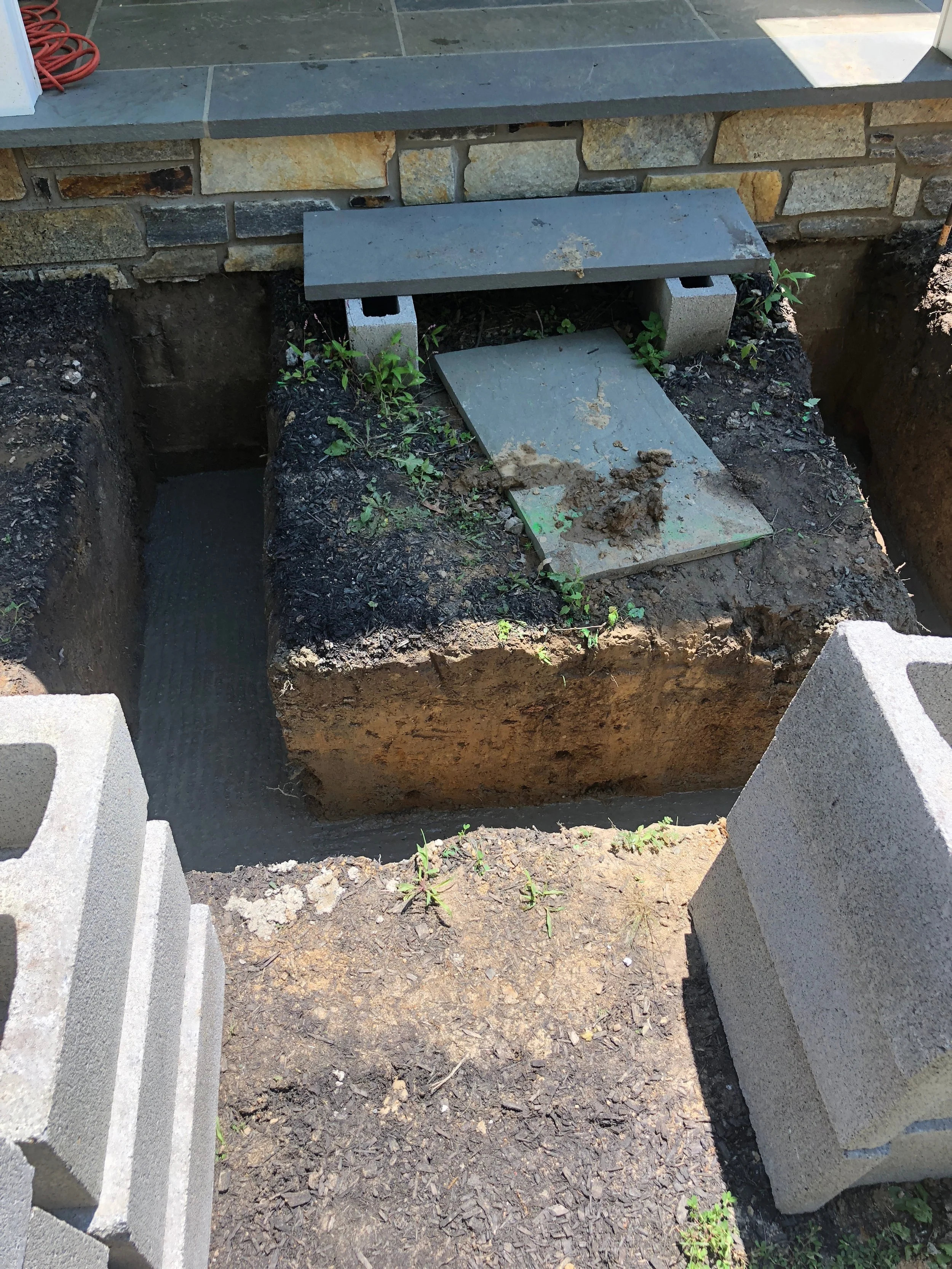 I couldn’t believe how deep the hole had to be to build the landing! This was all going on over the July 4th holiday, so I was actually home for a lot of this process. It was crazy to see Mike in action and how much work went into all of this.