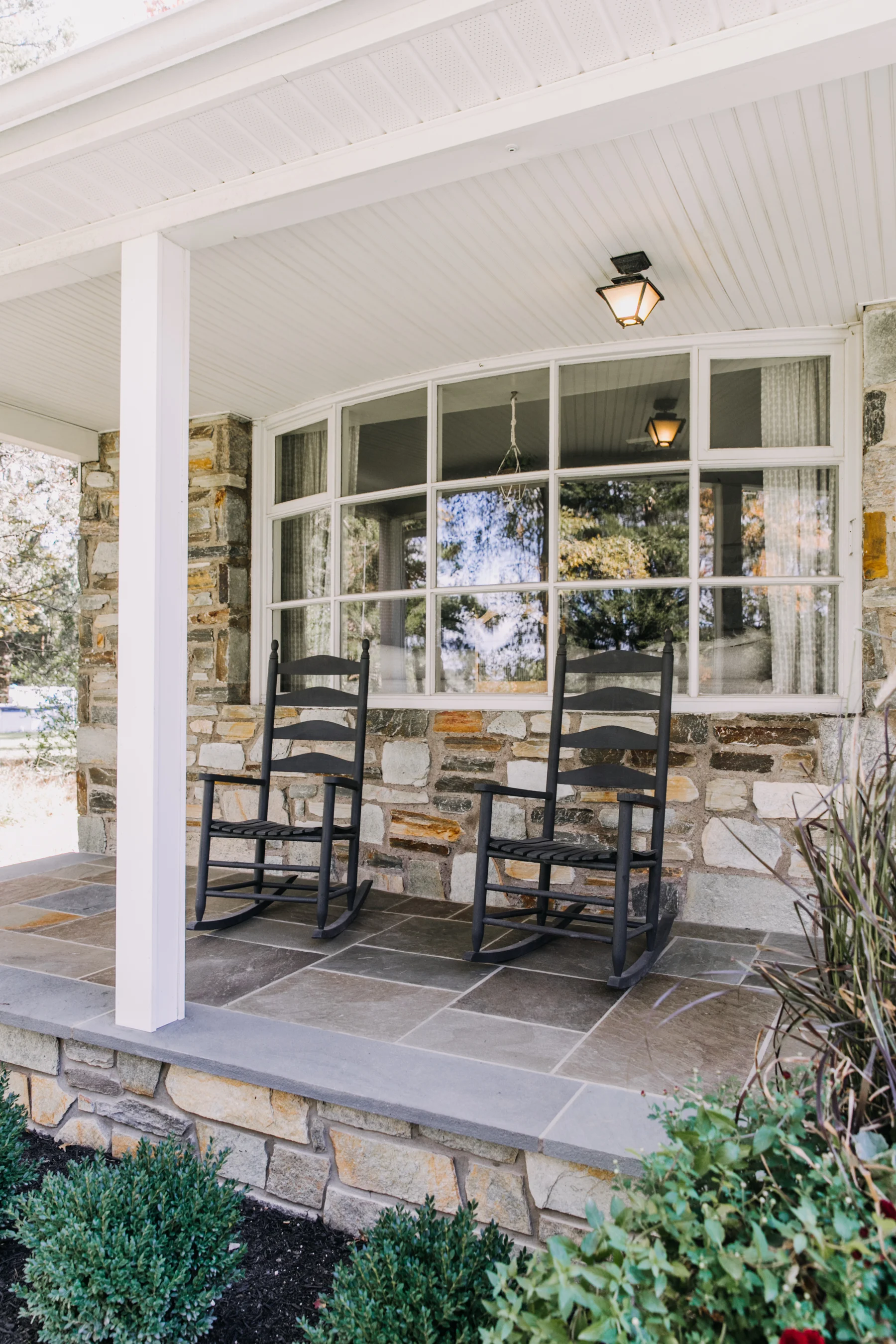 We also painted the rocking chairs that came with our house when we purchased it. I love that we were able to use the existing chairs, but update them to match the front door and shutters.