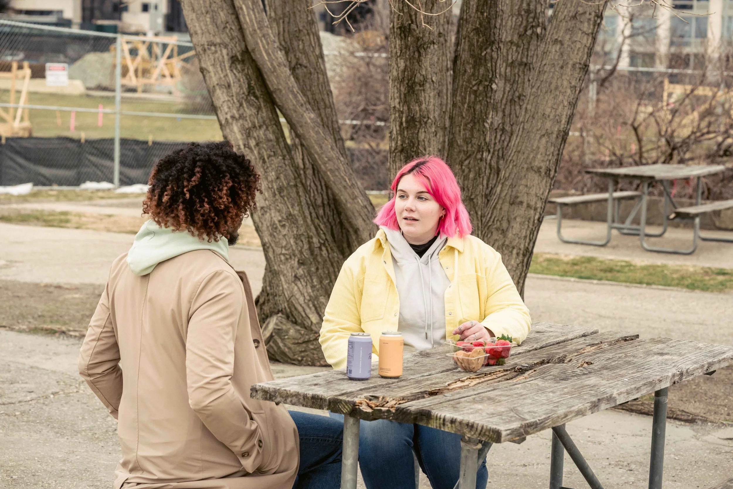 Two friends talking outdoors, one seeking reassurance from the other, OCD support, Hoboken NJ counseling