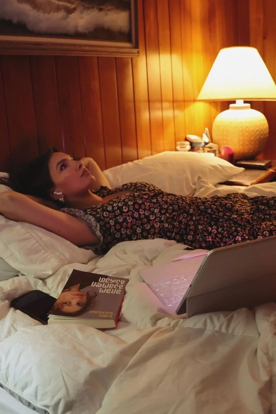 Woman lying in bed at night looking up in thought, an example of getting caught in a cognitive distortion, Hoboken NJ therapist
