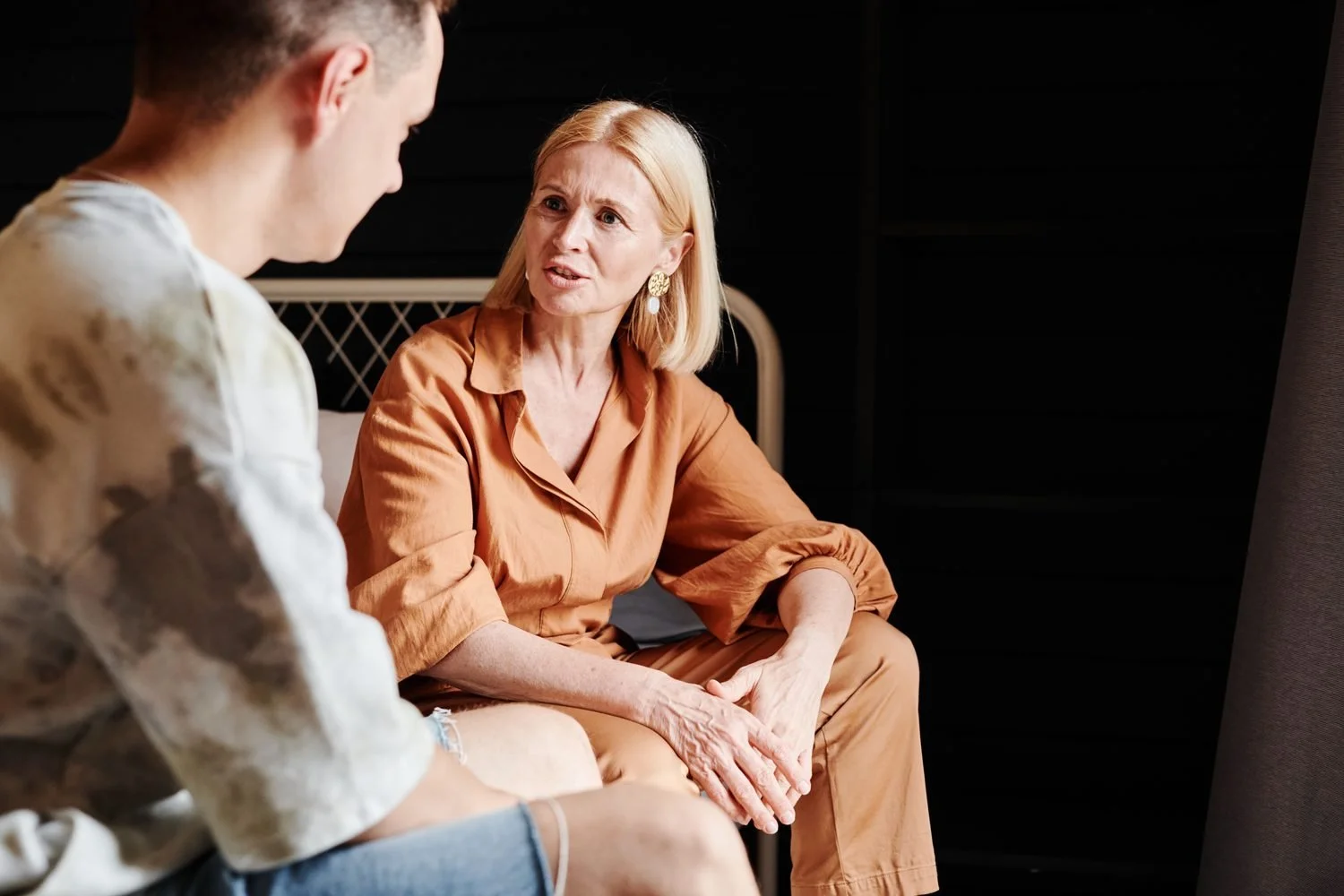 Adult client talking with a therapist during a counseling session, effects of a narcissistic parent on adult child Hoboken NJ counselor