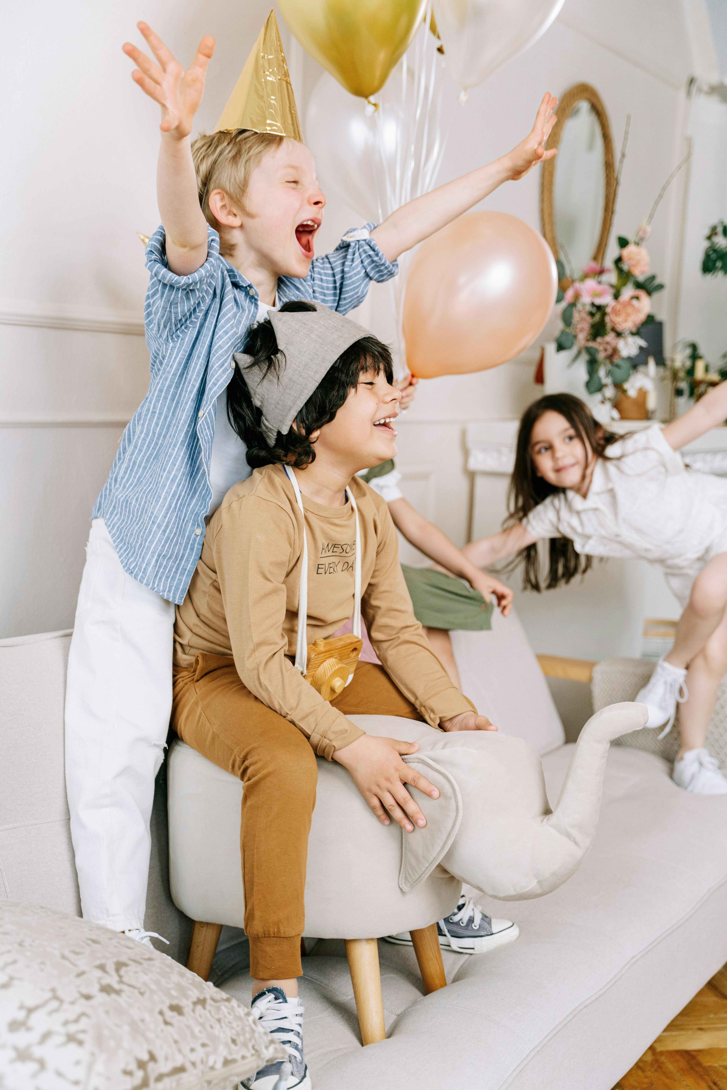 Three siblings playing with balloons at a party, golden child syndrome Hoboken NJ therapist