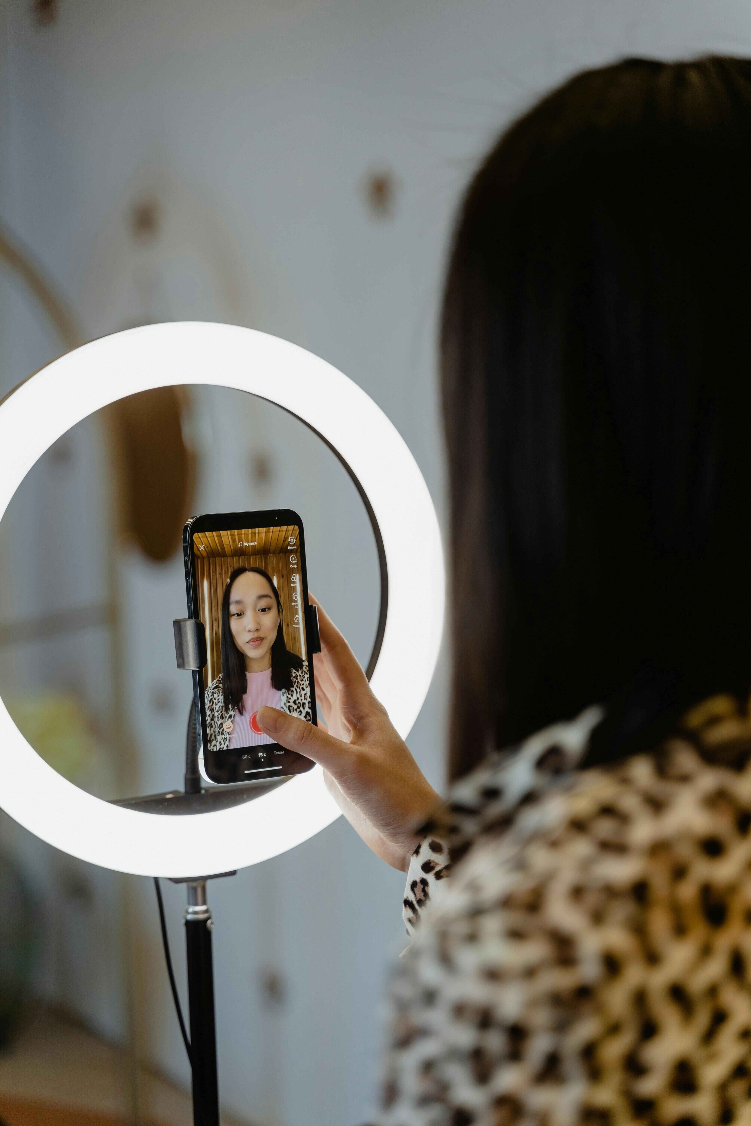A woman recording herself on camera reflecting on narcissistic collapse signs and self-image issues with guidance from a NJ therapist