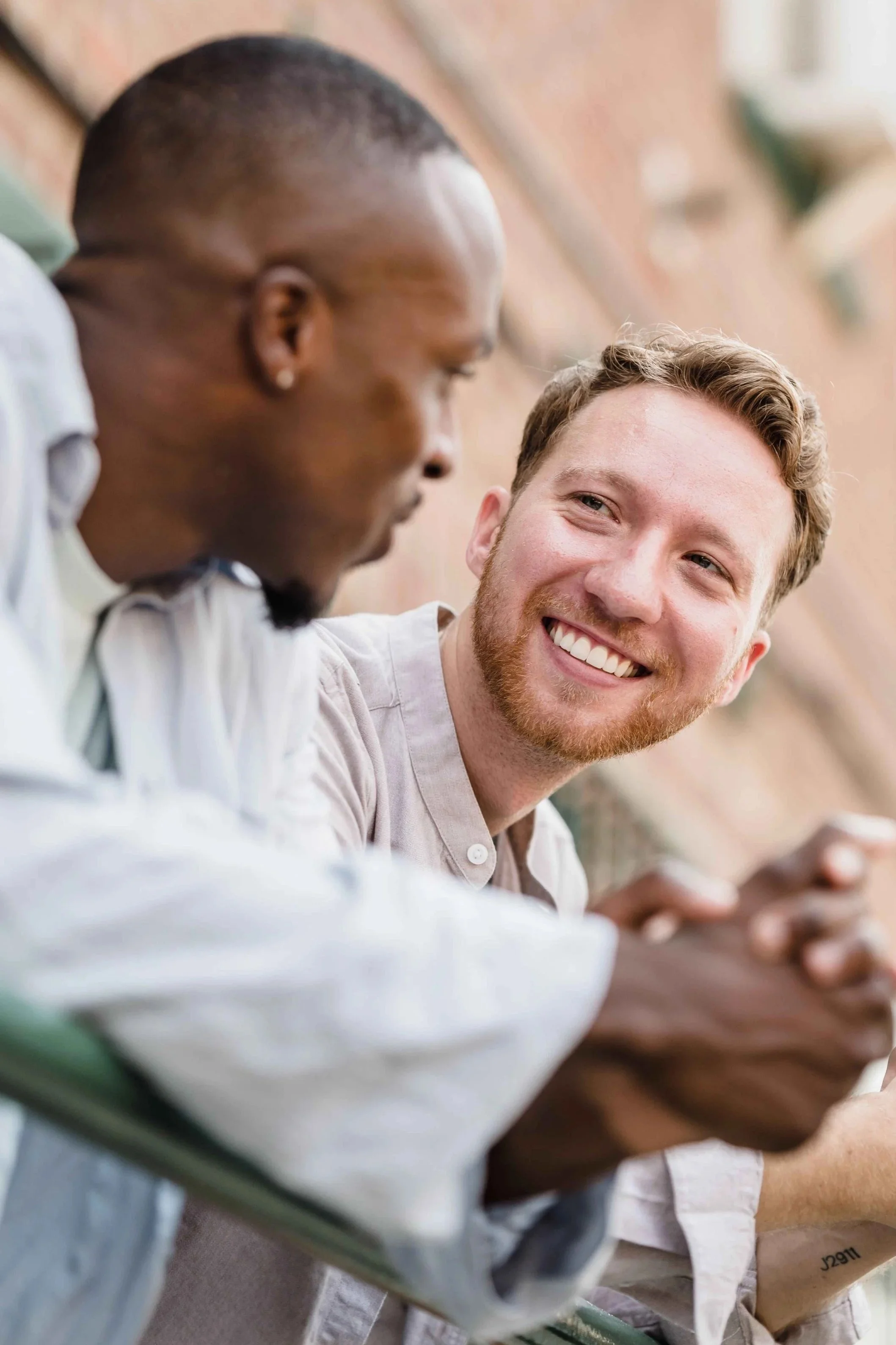 Two friends having a hard conversation about friendship imbalance, Hoboken NJ counselor