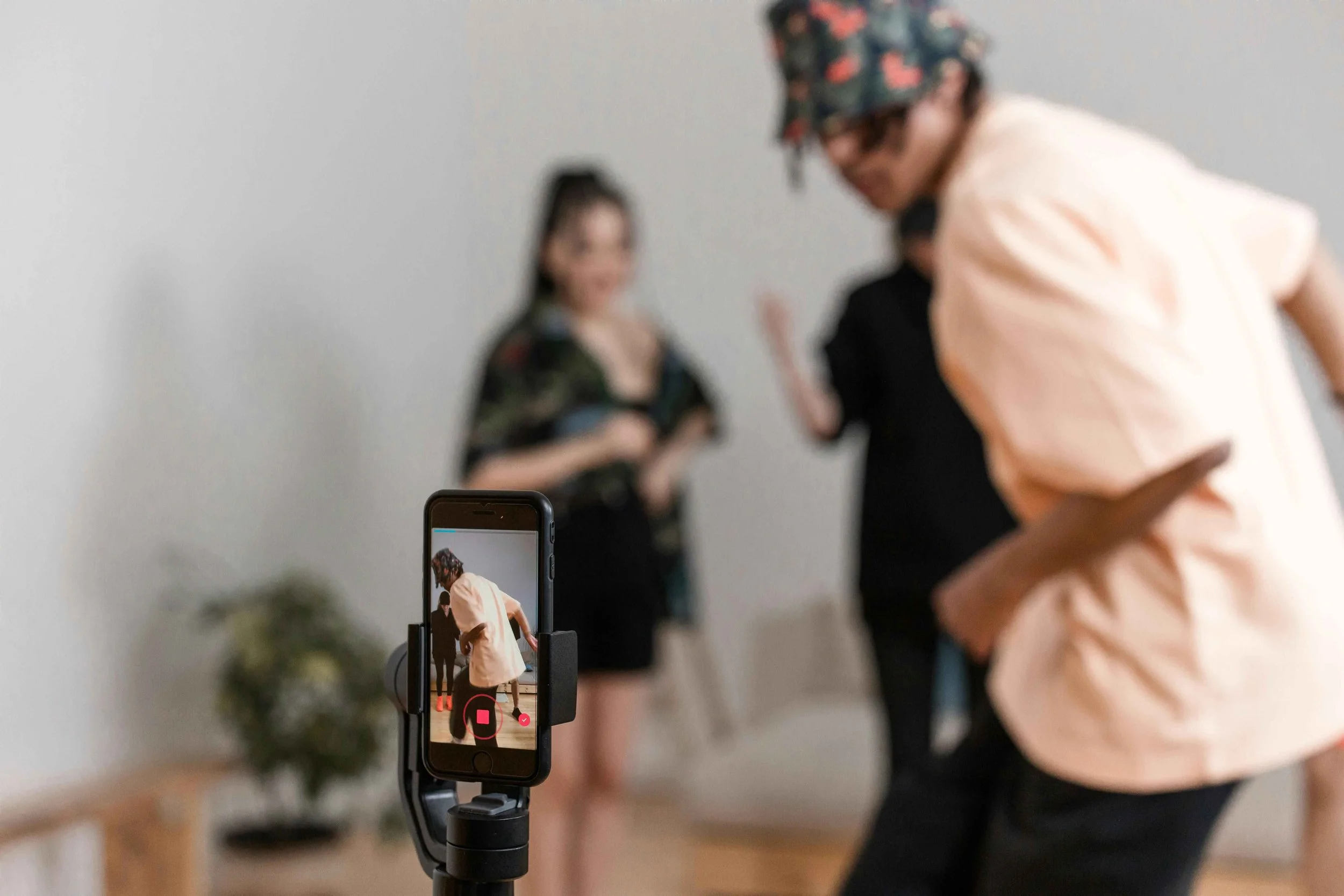 A group of teenagers dancing and recording a TikTok video, representing social media use and teen mental health counseling in Hoboken NJ