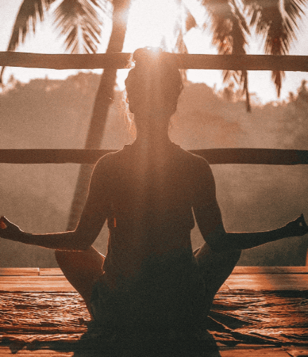 Woman practicing habit formation of meditation