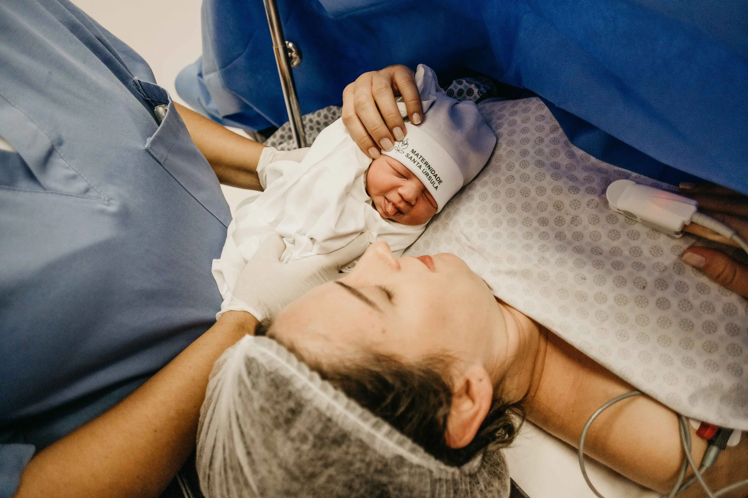 Newborn baby resting on mother's chest after delivery — birth trauma and postpartum PTSD therapy support in Hoboken, NJ and virtually across NJ, NY, and FL