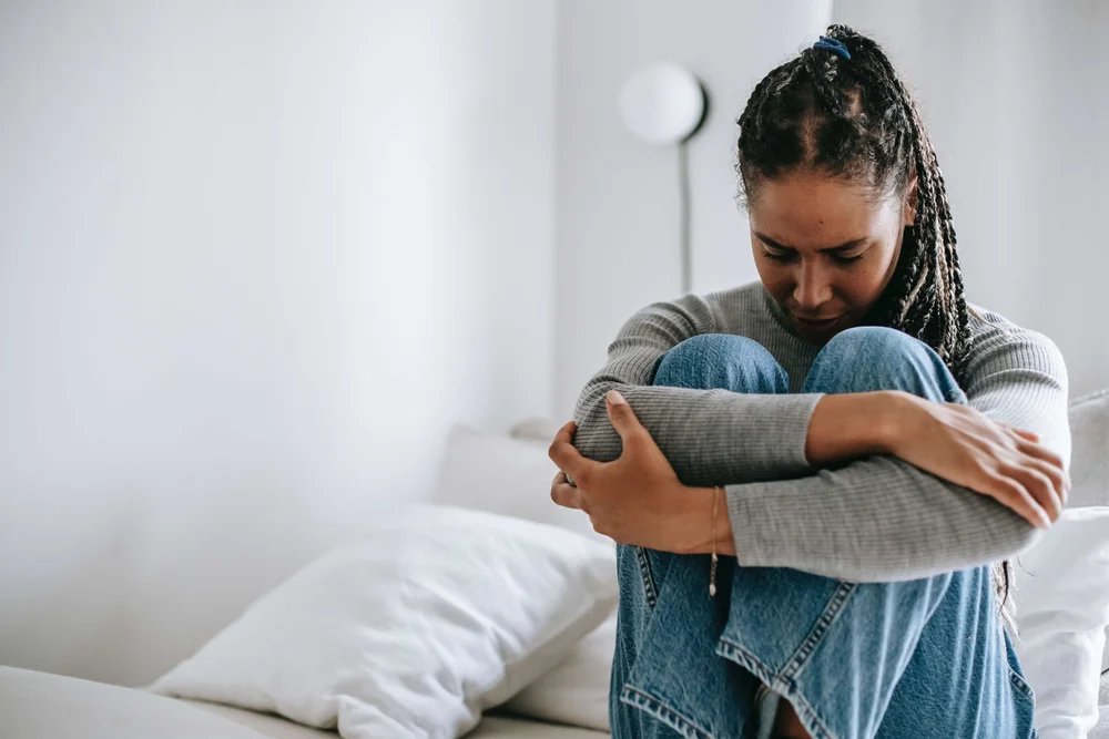 A woman feeling anxious, supported by anxiety counseling at Anchor Therapy in Hoboken, NJ.