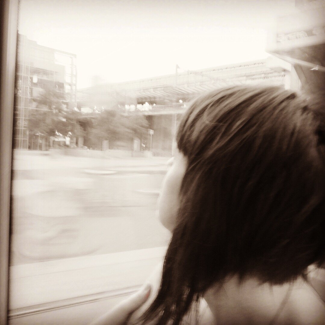  photo Heather looking out of window in train 
