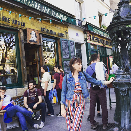  Photo of Heather standing in front of Shakespeare and Company in Paris 
