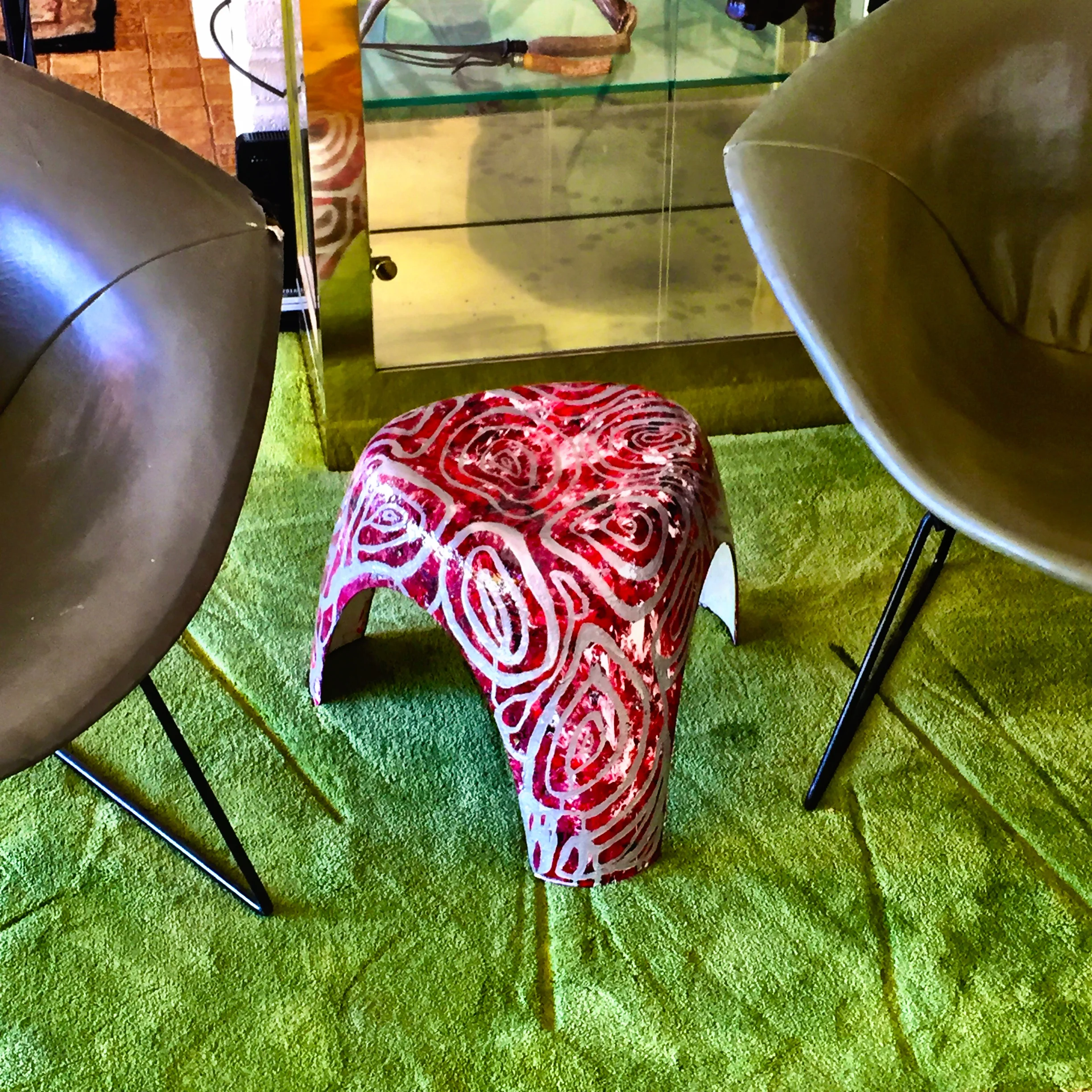 Painted elephant stool with Bertoia chairs