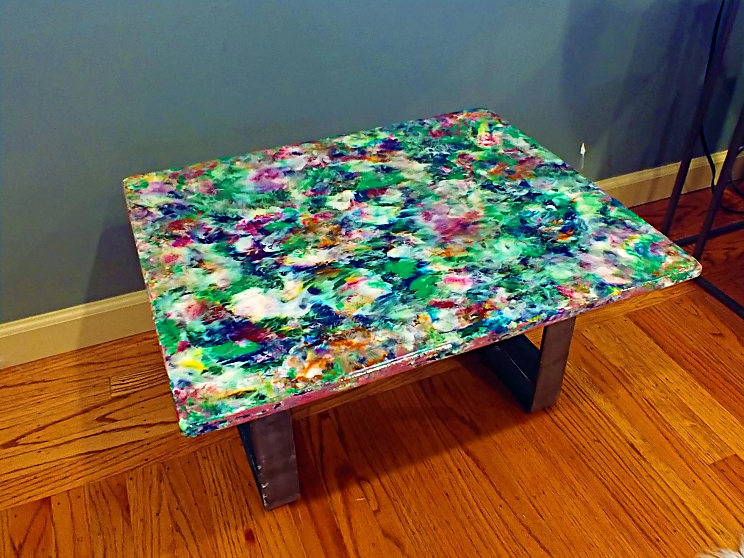 Custom table built and painted by me with found packaging metal and plywood.