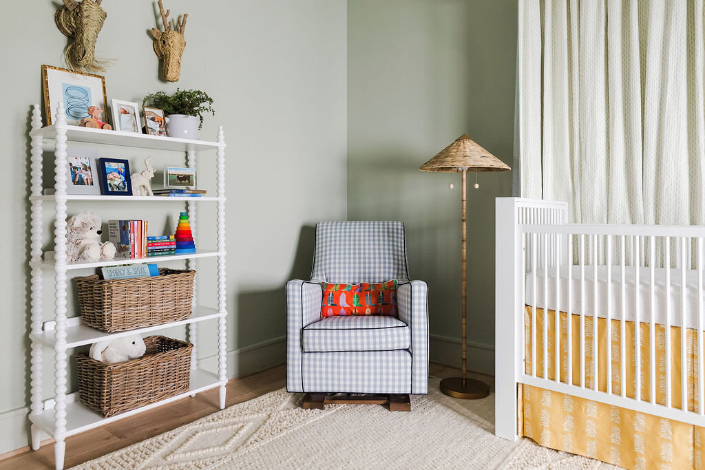 Reading Chair in Baby Room with Green Wallpaper | Houston Interior Design Firm
