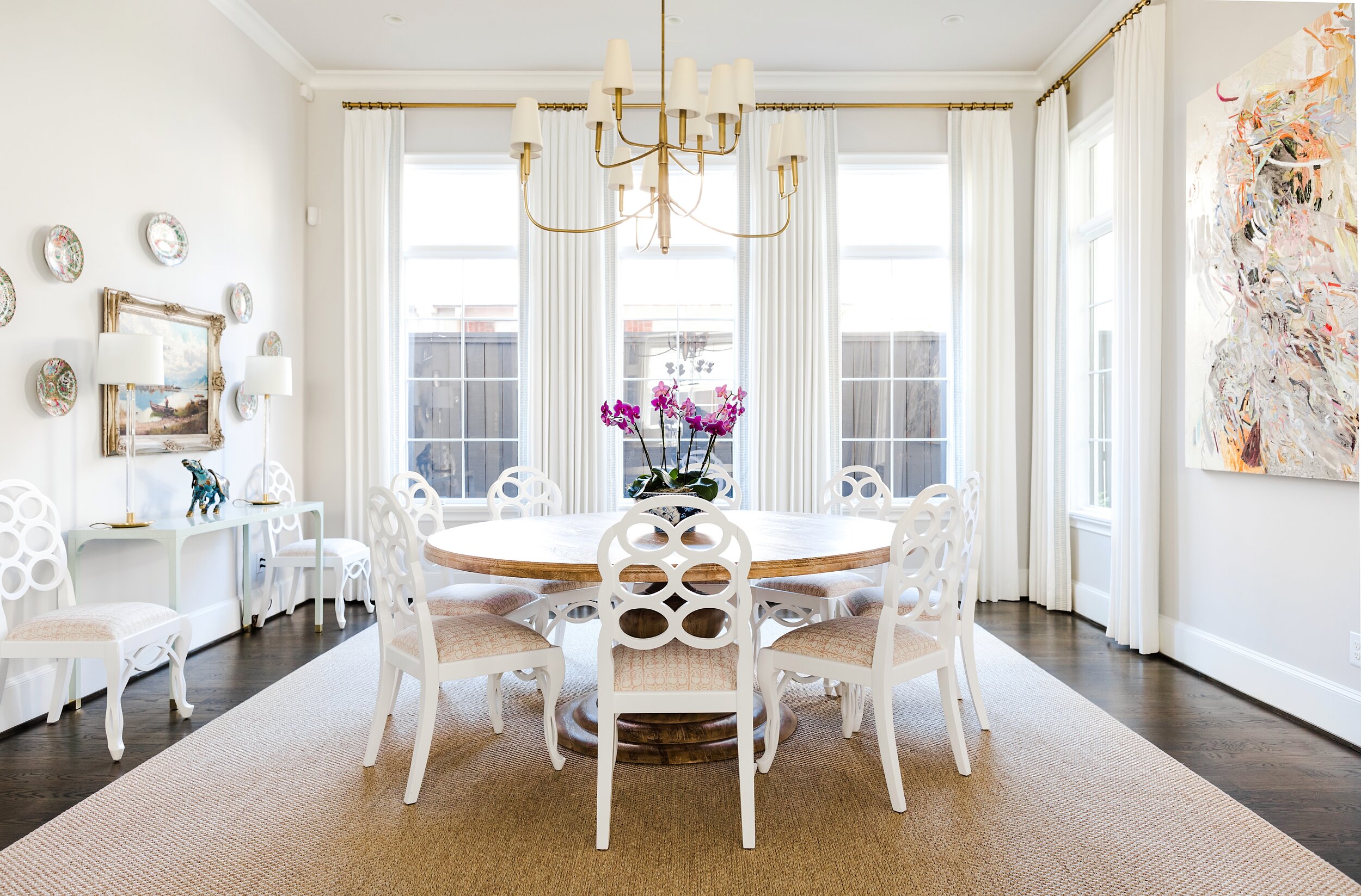 Country Farmhouse Inspired Dining Room with Chandelier and White Dining Chairs