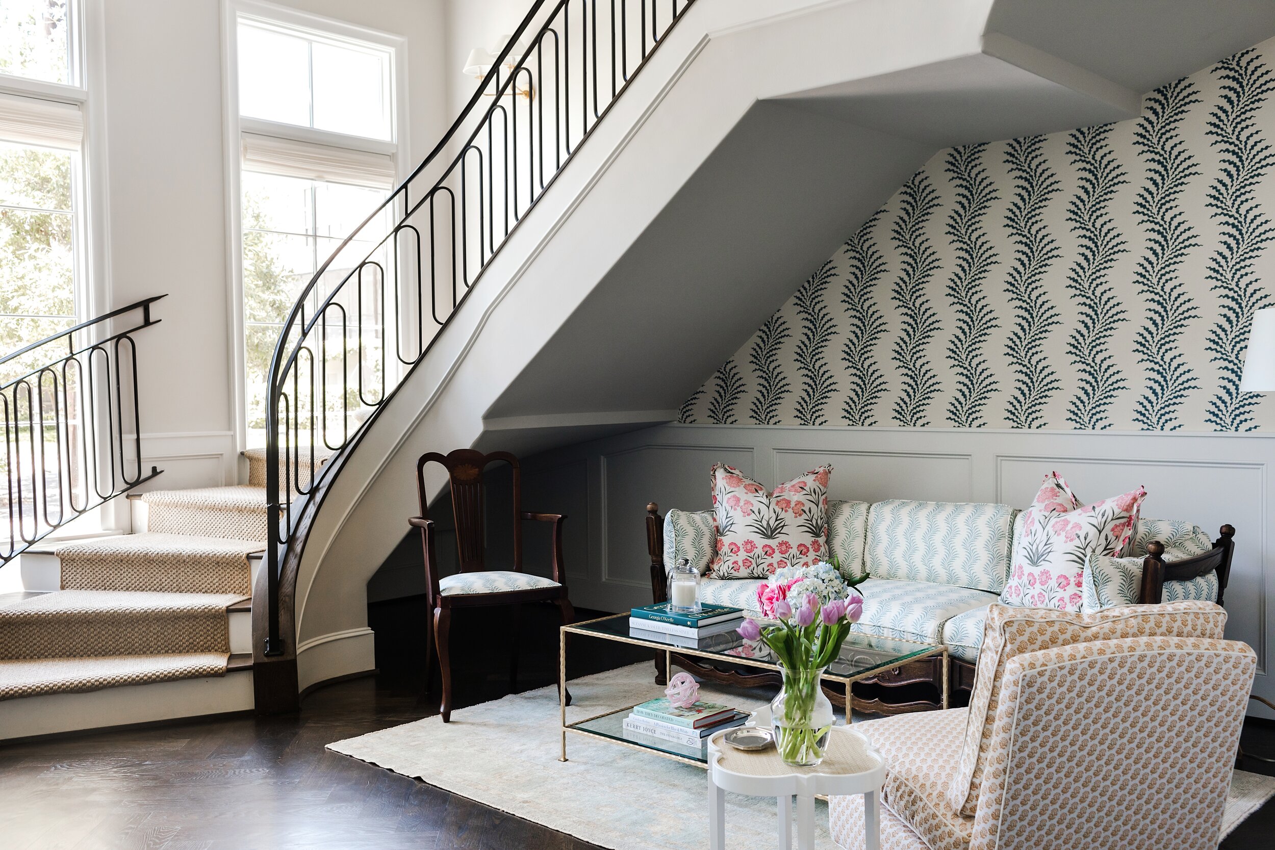 Comfortable Lounge Area Beneath Wrapping Staircase