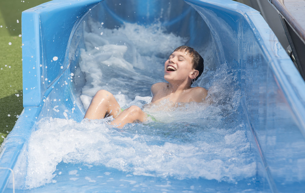 Brisbane swimmer Joseph Feguson has fun on Pacific Dawn's new waterslide.jpg