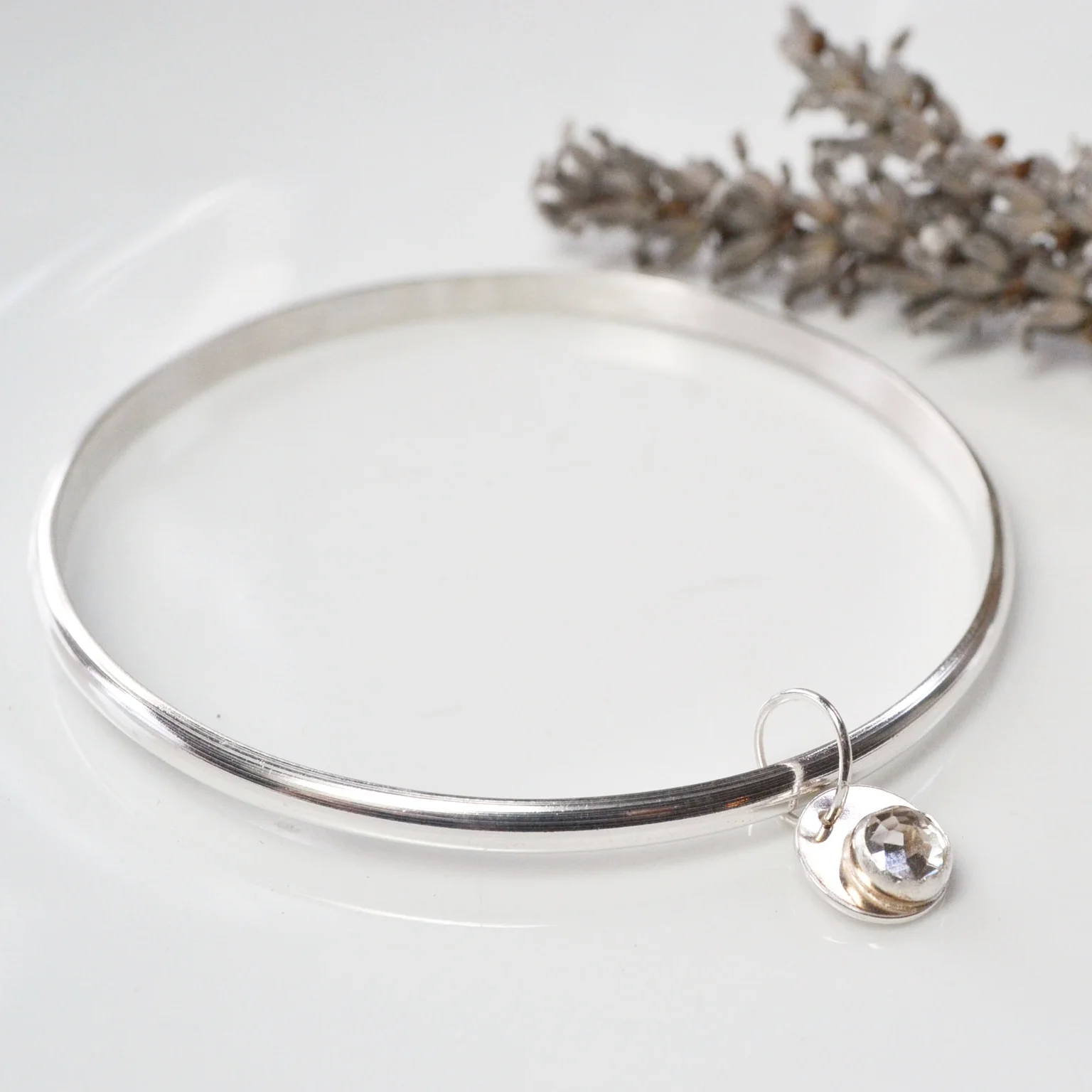 white topaz charm bangle.jpg
