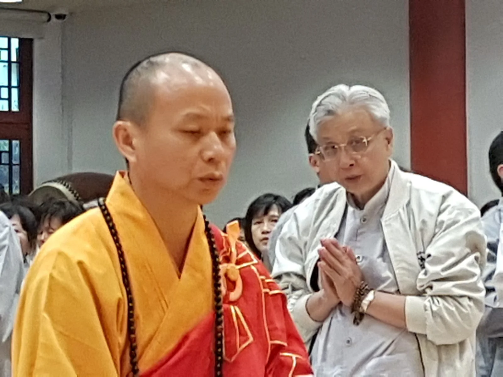 BW Monastery Ven. Jing Yuan & attendees in deep prayer at precepts taking