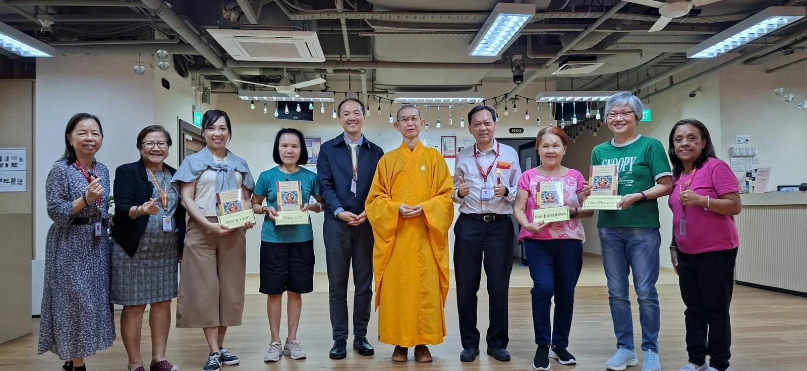 Lamrim Learning at our Bugis District: Receiving their Lamrim books