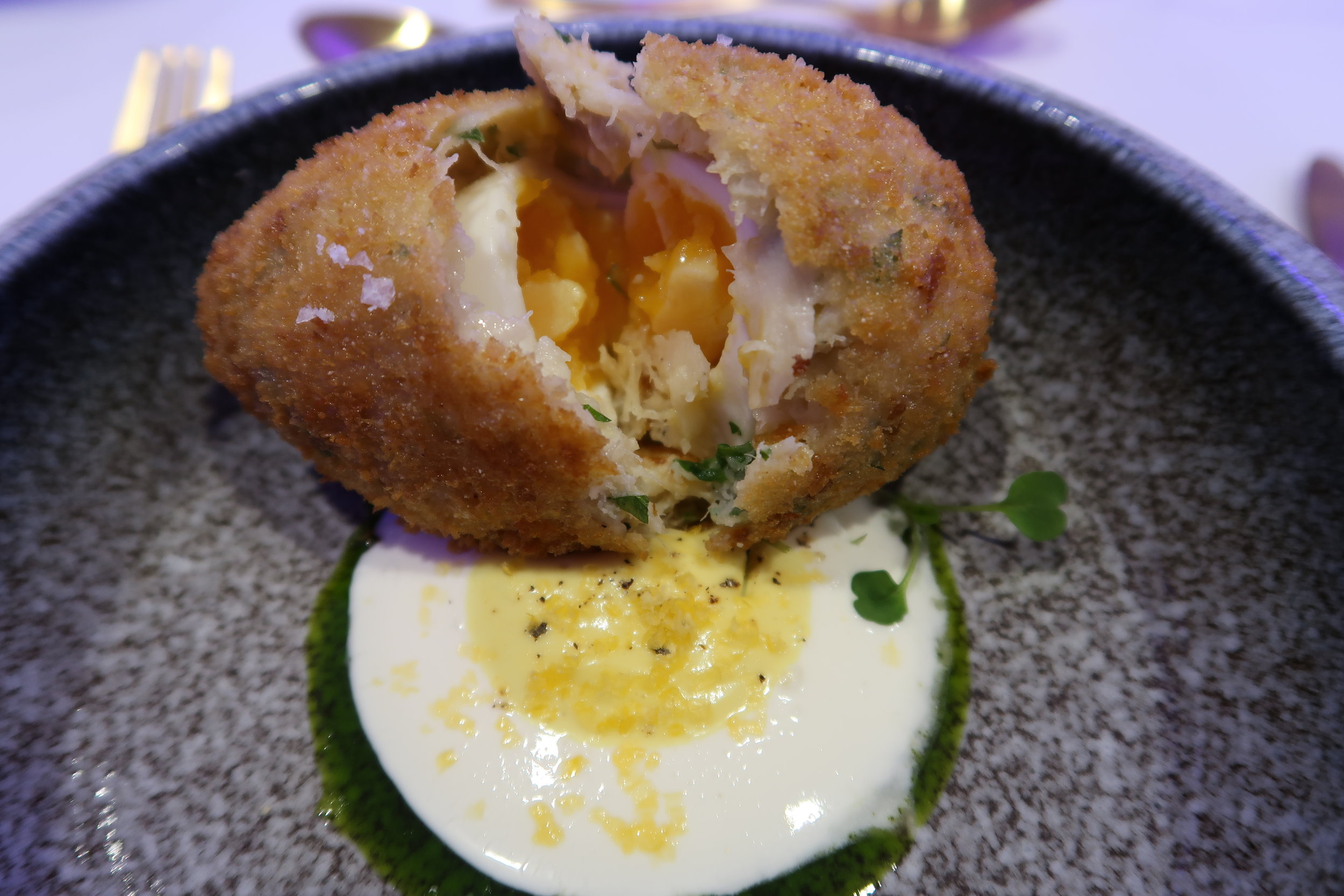 Scotch egg with mustard mayo and cream cheese sauce