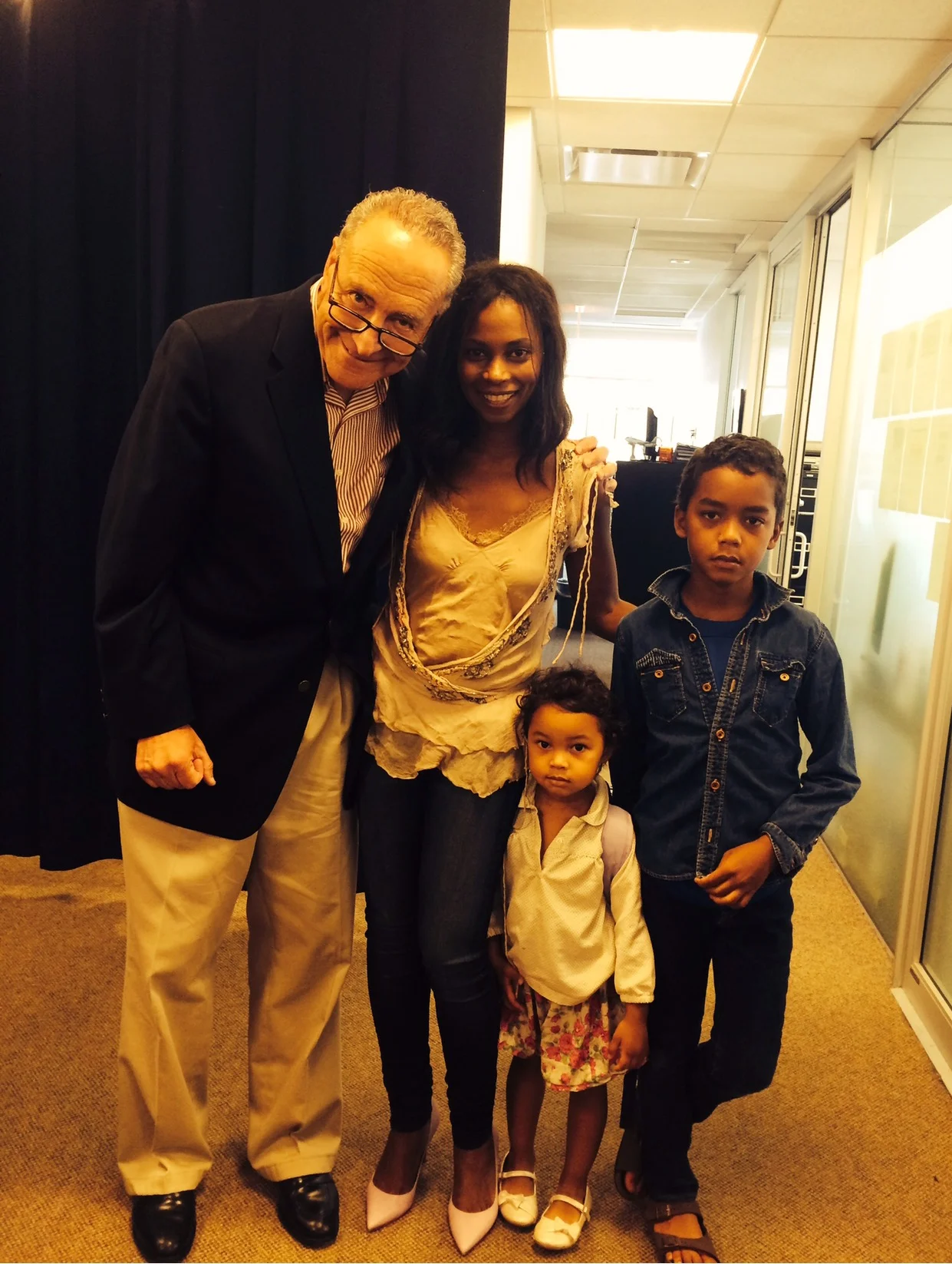 Penelope and her children with US Senator Charles Schumer 