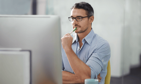 man at computer working on product development