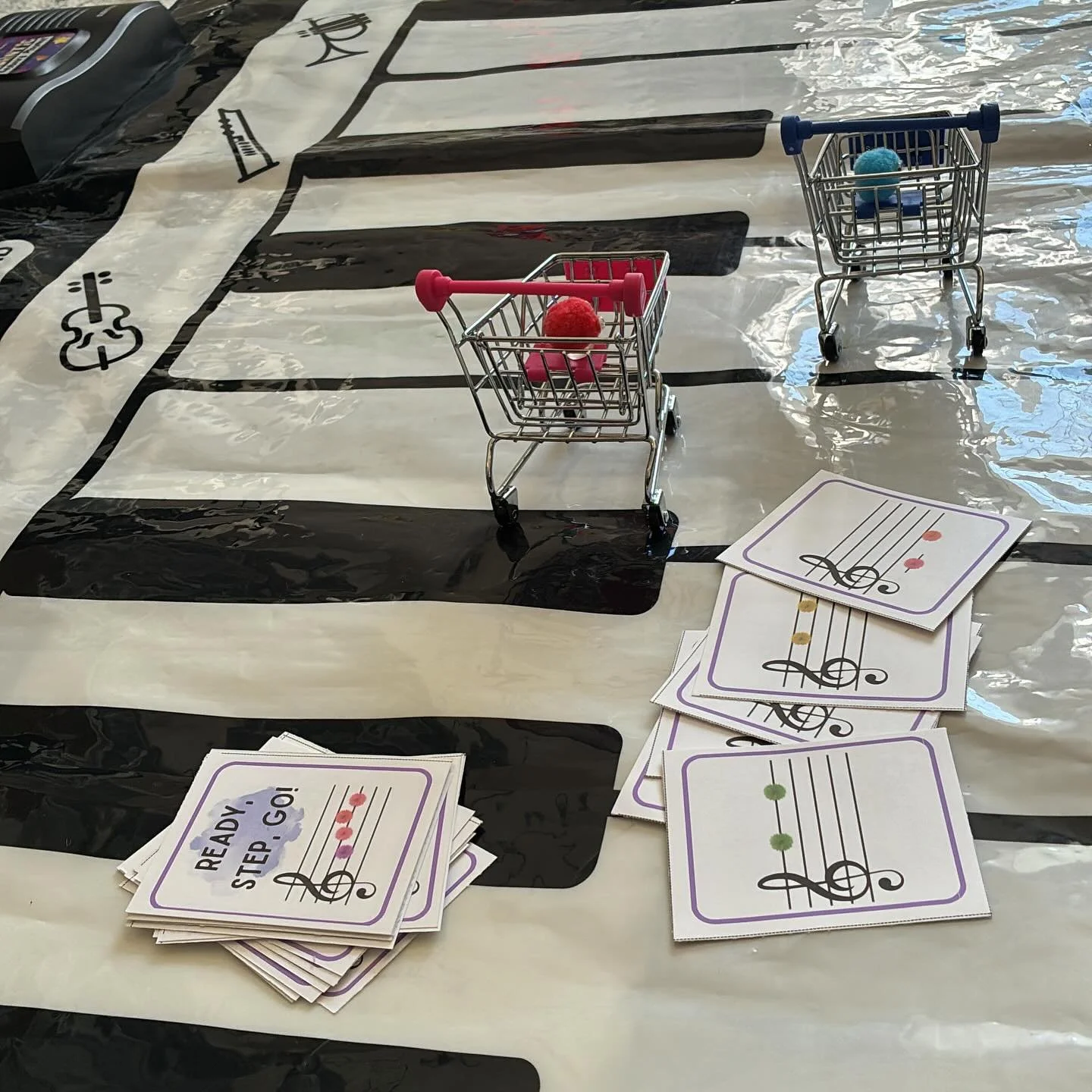 Step up, step down, or repeated note? 🎹

We played on the big floor piano, with tiny grocery carts. But you could play this game on your piano, keyboard, or the printable game board! So fun to try out the new game with one of my students yesterday! 
